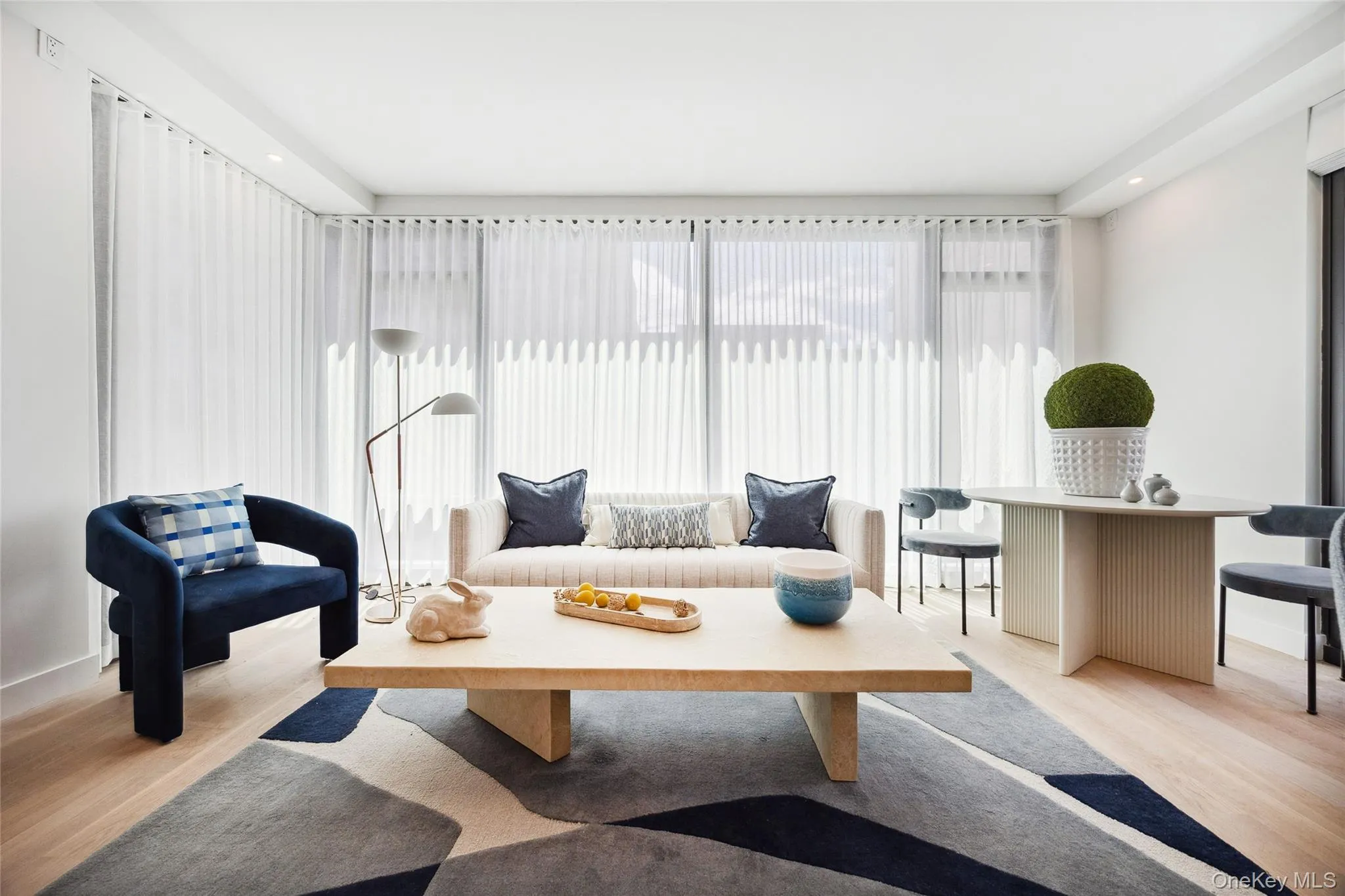 Sitting room with light wood-style flooring Sitting room with light wood-style flooring