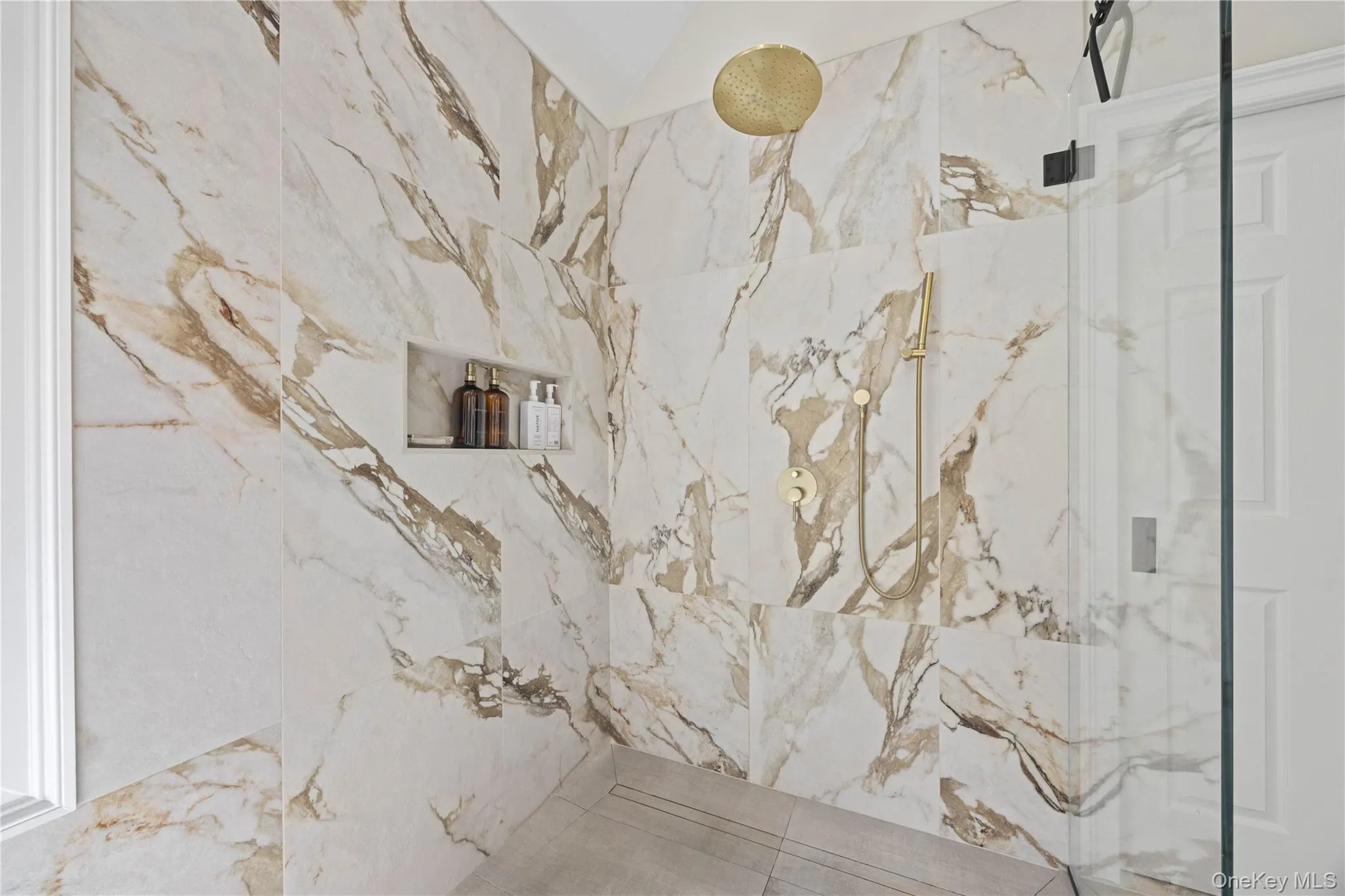 Bathroom view of a marble finish shower Bathroom view of a marble finish shower
