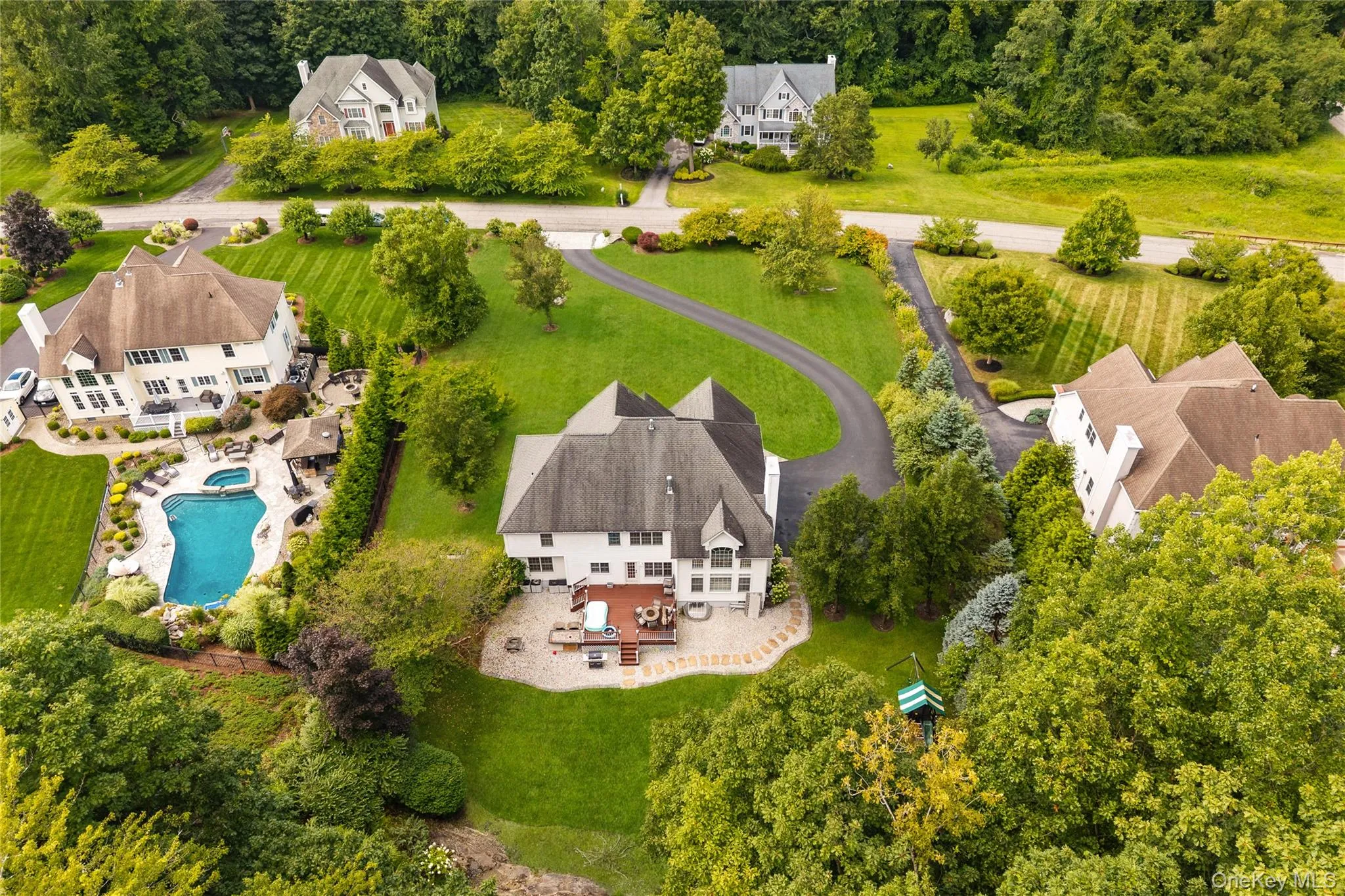View of subject property featuring a pool View of subject property featuring a pool
