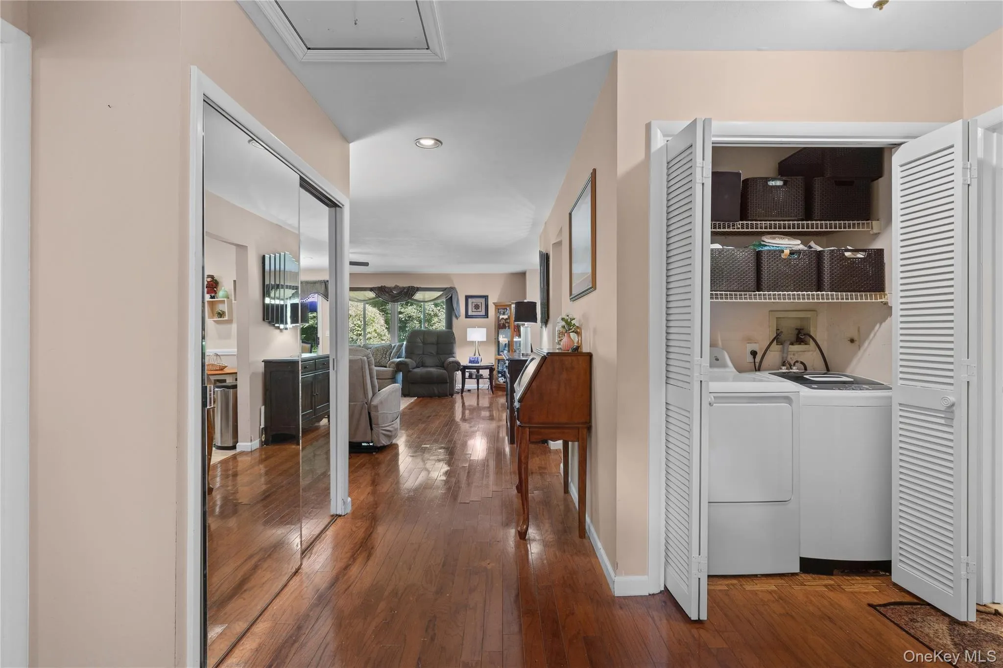 Entry hall with coat closet, double closet and separate side by side washer and dryer area Entry hall with coat closet, double closet and separate side by side washer and dryer area