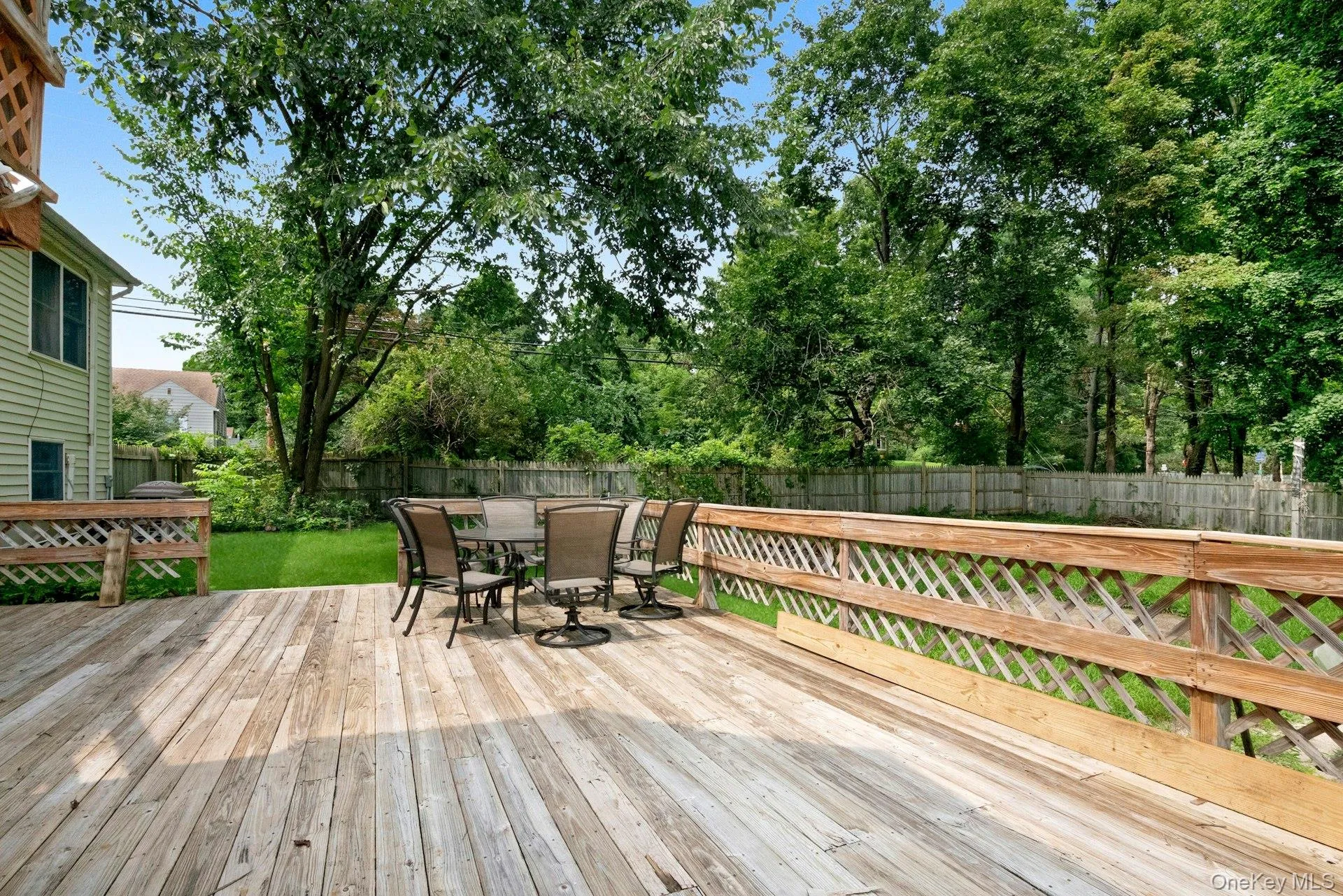 Expansive lower deck with plenty of room for outdoor seating and dining. Expansive lower deck with plenty of room for outdoor seating and dining.