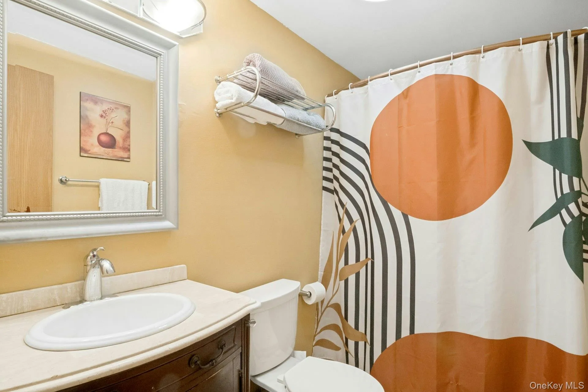 Full hall bathroom with tile flooring, single vanity, and tub/shower combination. Full hall bathroom with tile flooring, single vanity, and tub/shower combination.