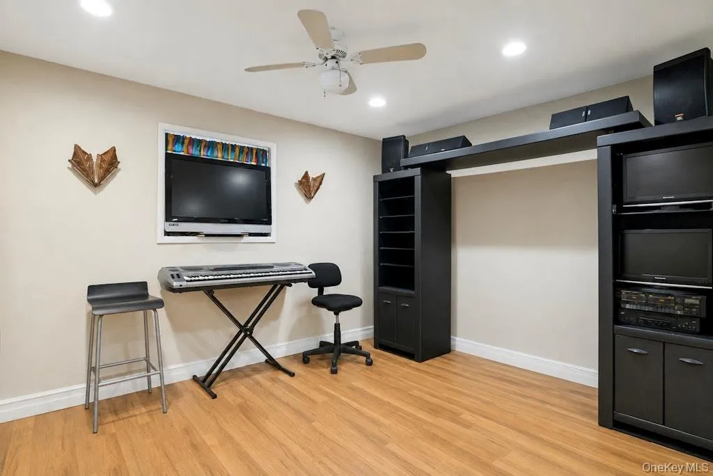 Large family room located on the lower level, adjacent to home gym. Large family room located on the lower level, adjacent to home gym.