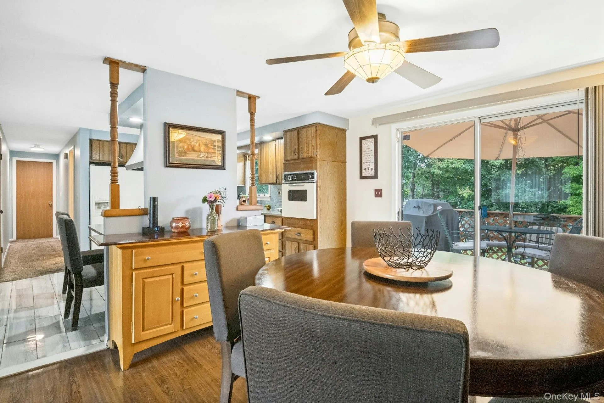 Dining area with sliding glass doors providing access to the deck and backyard. Dining area with sliding glass doors providing access to the deck and backyard.