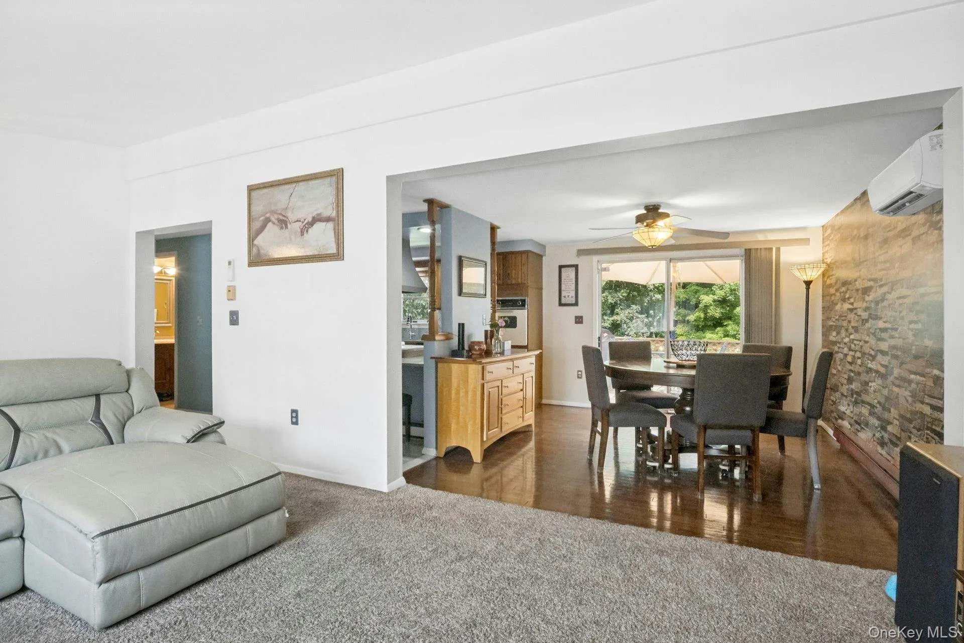 Open view from the living room into the dining area, highlighting the connected main-level layout. Open view from the living room into the dining area, highlighting the connected main-level layout.