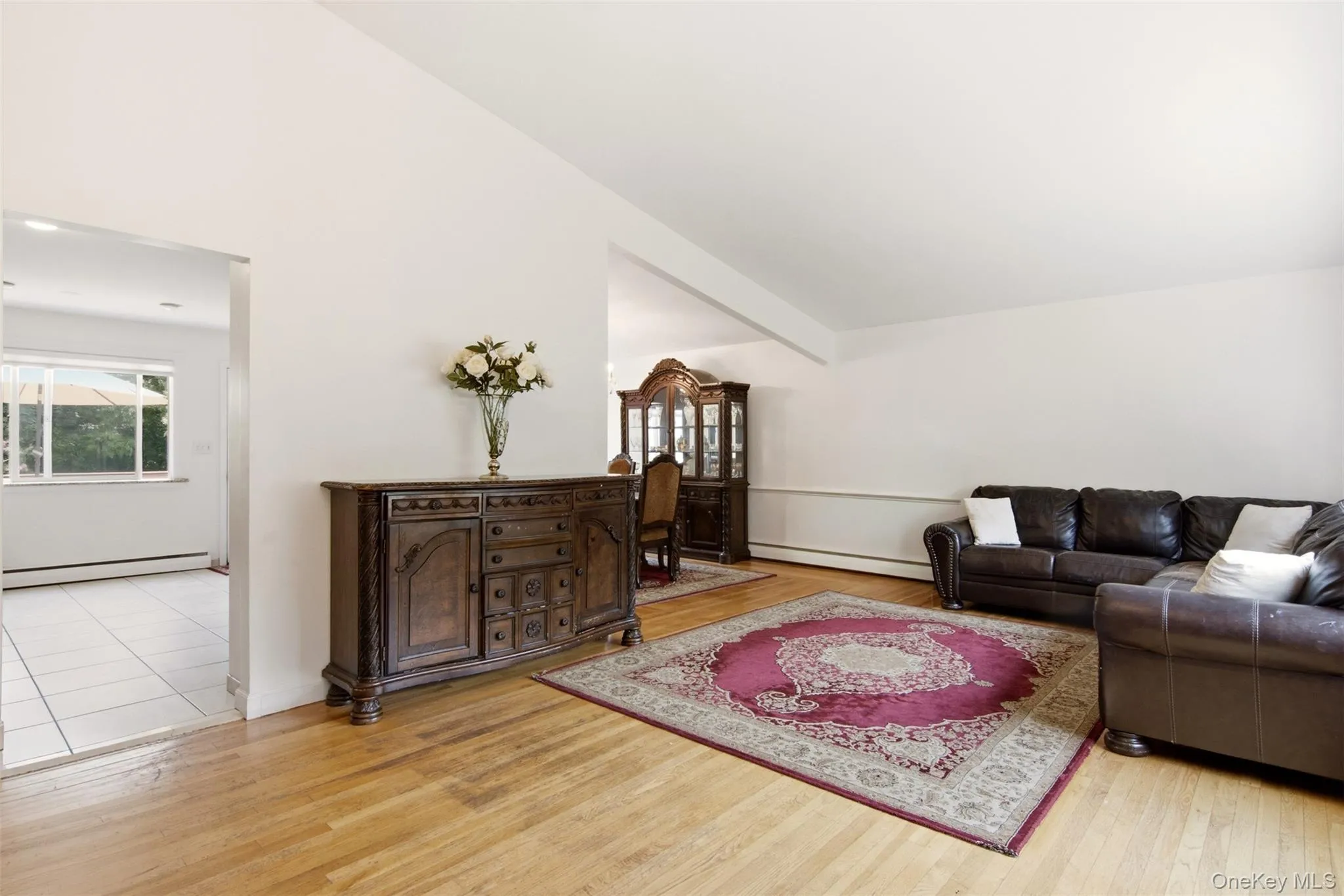Hardwood-finish flooring, white walls, and bright white trim Hardwood-finish flooring, white walls, and bright white trim