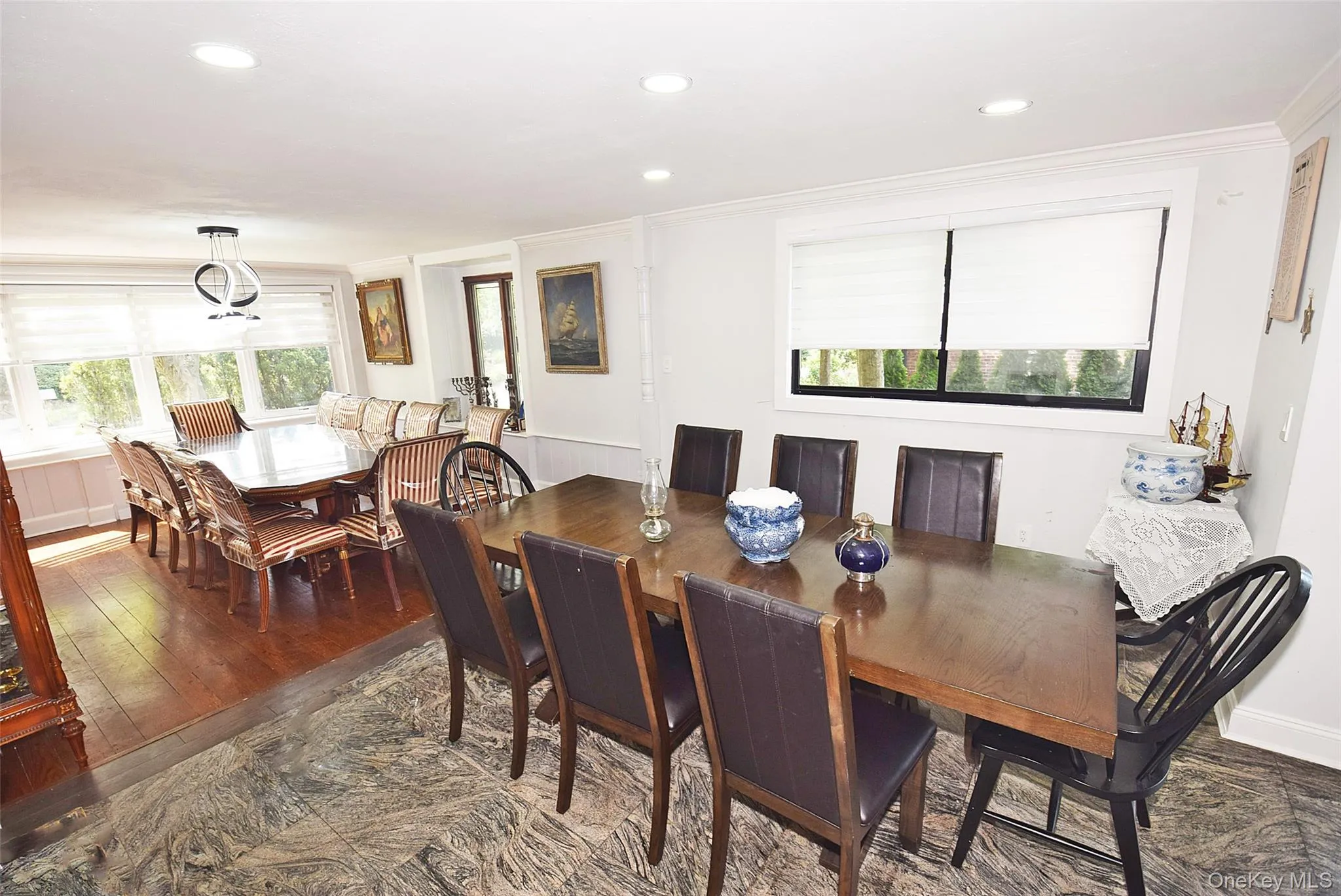Recessed lighting throughout, crown molding, large window with ample natural light, marble-finish flooring, and wood flooring Recessed lighting throughout, crown molding, large window with ample natural light, marble-finish flooring, and wood flooring