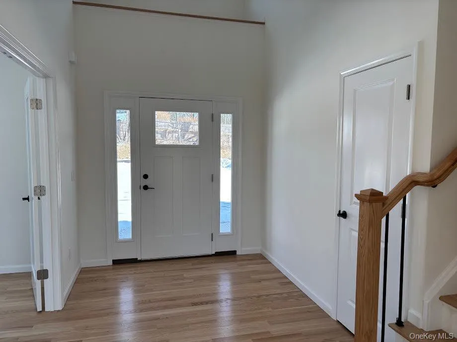 Entryway featuring light hardwood / wood-style floors Entryway featuring light hardwood / wood-style floors