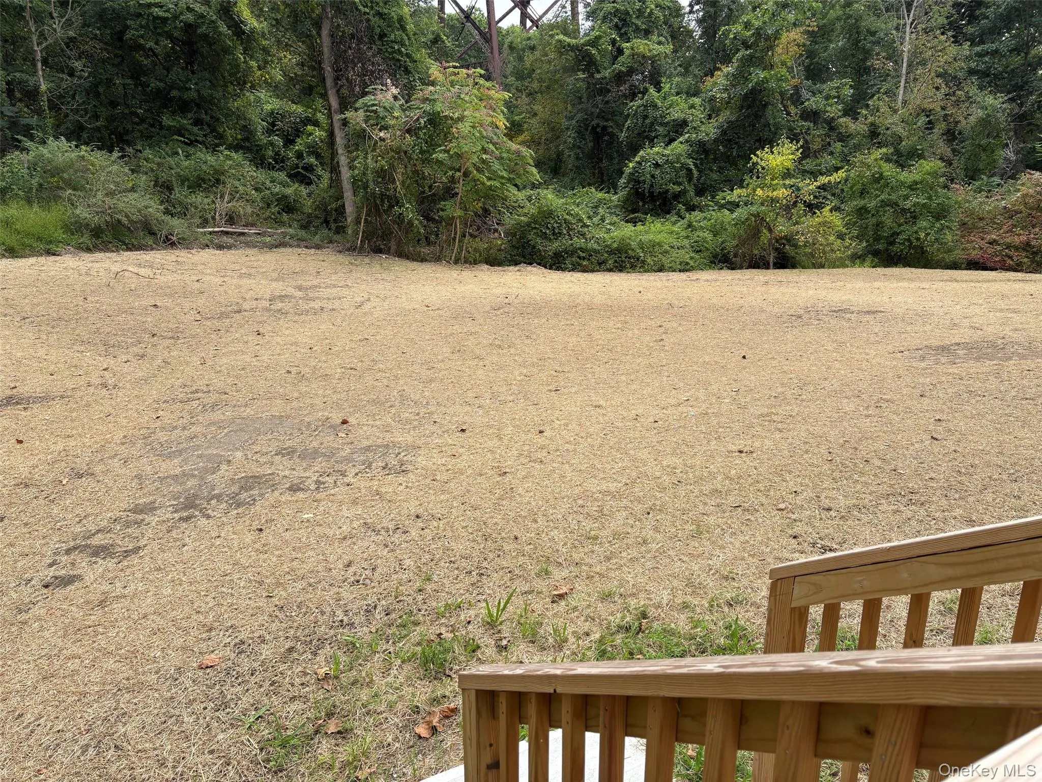 view of large level backyard that is perfect for a future in ground pool view of large level backyard that is perfect for a future in ground pool