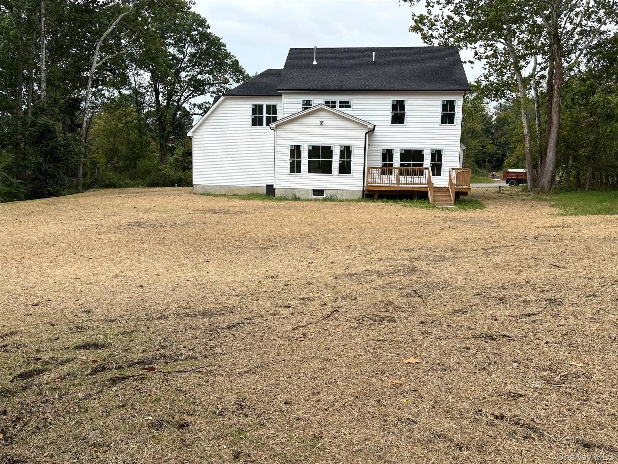 Expansive level and seeded backyard viewed from treeline. Expansive level and seeded backyard viewed from treeline.