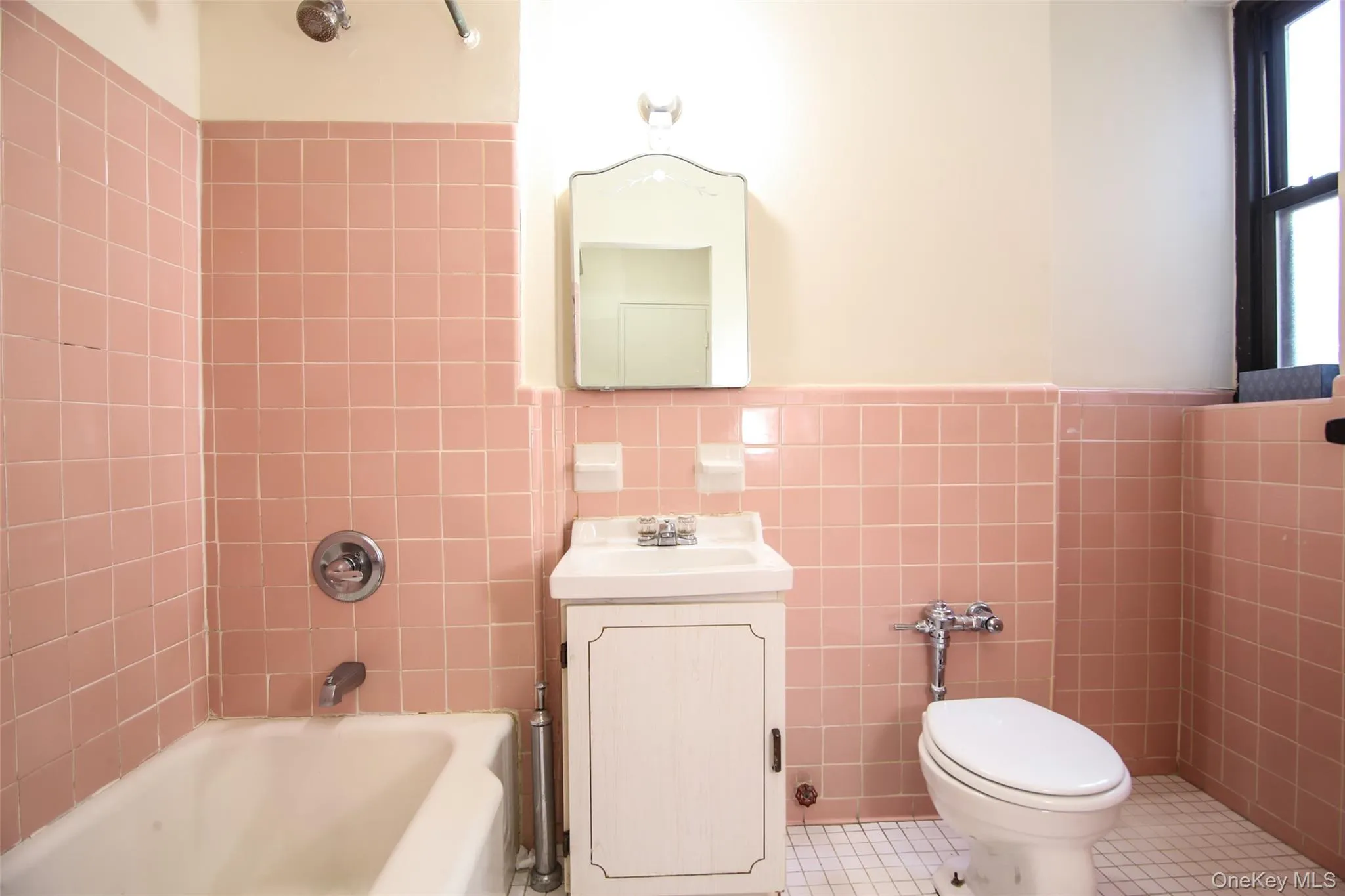 *Bathroom has been slightly updated since picture was taken*The Renaissance vintage bathroom with window off of the dressing area deserves beautiful and fluffy white towels. Over the sink is a spacious medicine cabinet for all your needs. And, since you spend a large portion of your life getting ready in the bathroom - having the right lighting makes all the difference. *Bathroom has been slightly updated since picture was taken*The Renaissance vintage bathroom with window off of the dressing area deserves beautiful and fluffy white towels. Over the sink is a spacious medicine cabinet for all your needs. And, since you spend a large portion of your life getting ready in the bathroom - having the right lighting makes all the difference.