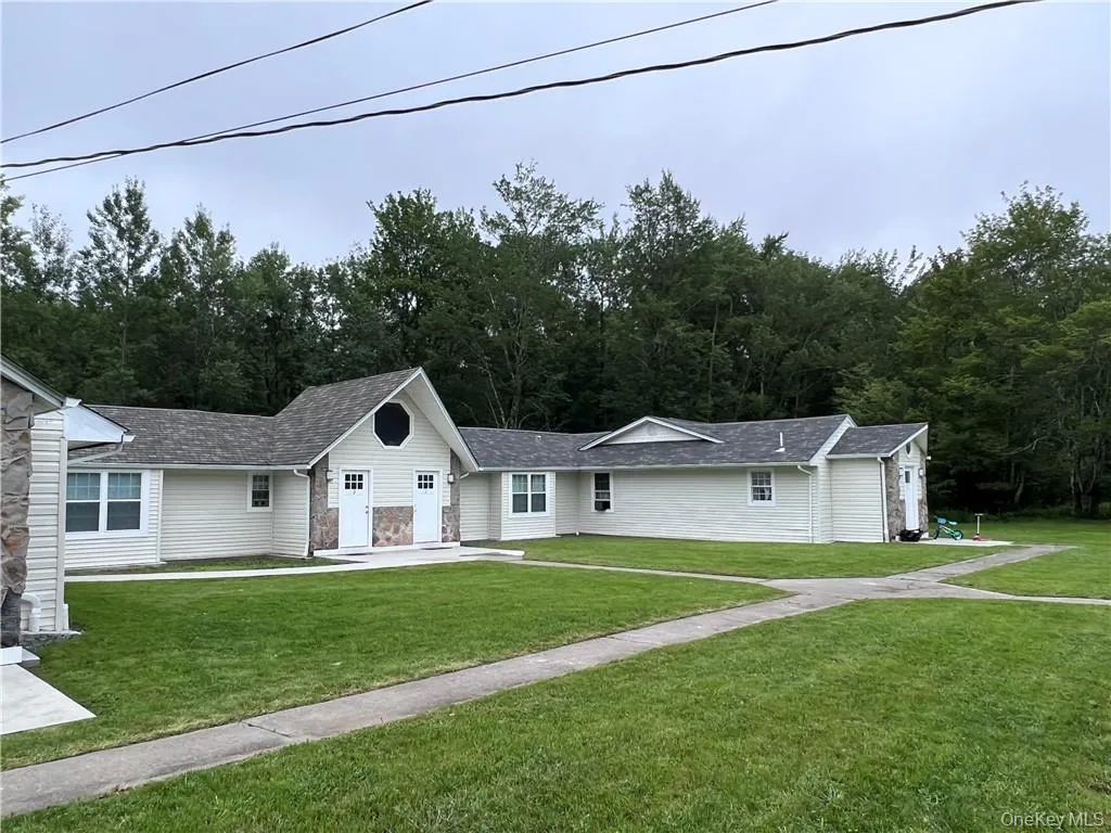 Ranch-style house with a front lawn Ranch-style house with a front lawn