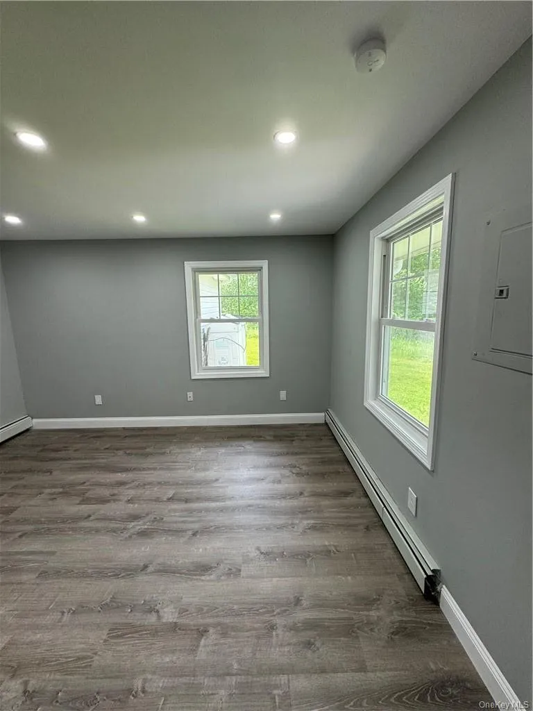 Bedroom featuring a baseboard heating unit Bedroom featuring a baseboard heating unit