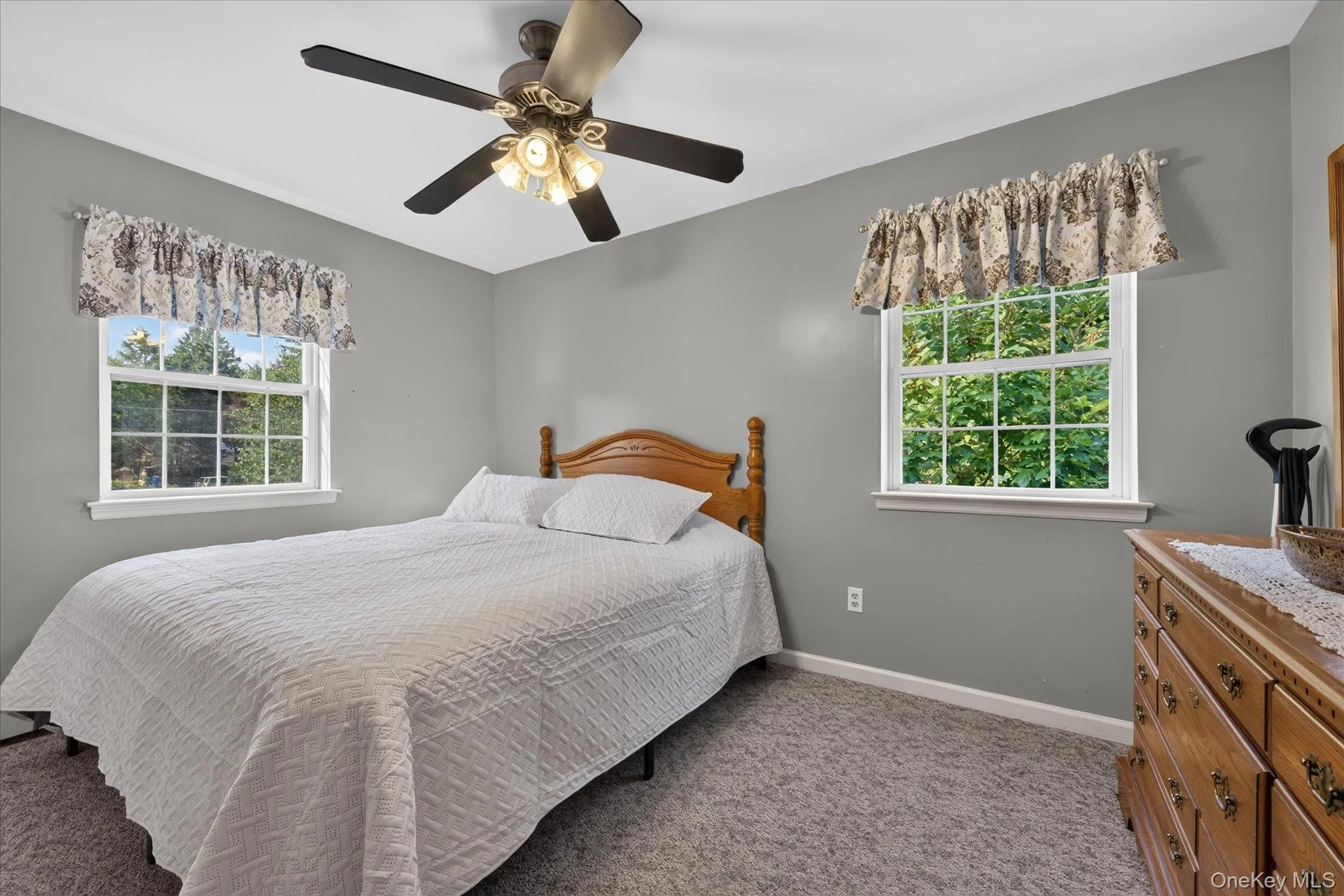 Recessed lighting, ceiling fan with integrated light fixture, and two double-hung windows Recessed lighting, ceiling fan with integrated light fixture, and two double-hung windows