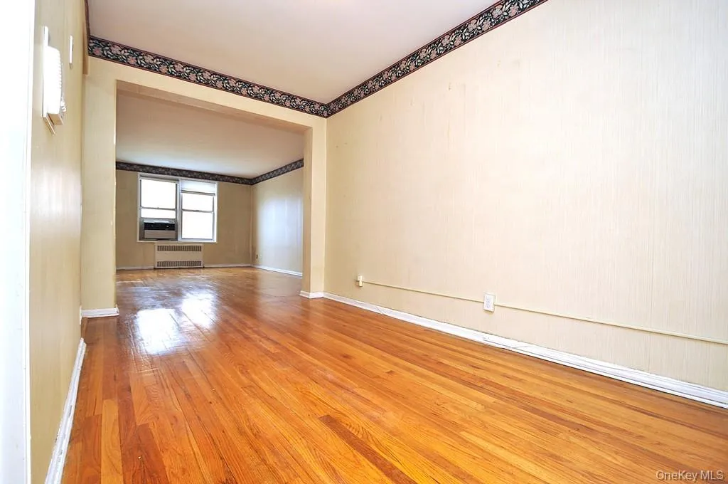 The dining area opens to the living room and has hardwood floors. The dining area is approx. 13'-0" x 8'-3". The dining area opens to the living room and has hardwood floors. The dining area is approx. 13'-0" x 8'-3".