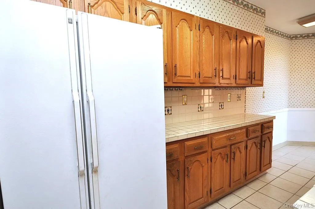 Eat-in kitchen has plenty of cabinets and counter space as well as a dishwasher, range and refrigerator. The kitchen is approx. 21'-7" x 7'-1" Eat-in kitchen has plenty of cabinets and counter space as well as a dishwasher, range and refrigerator. The kitchen is approx. 21'-7" x 7'-1"