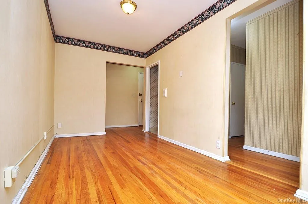 The dining area opens to the living room and has hardwood floors. The dining area is approx. 13'-0" x 8'-3". The dining area opens to the living room and has hardwood floors. The dining area is approx. 13'-0" x 8'-3".