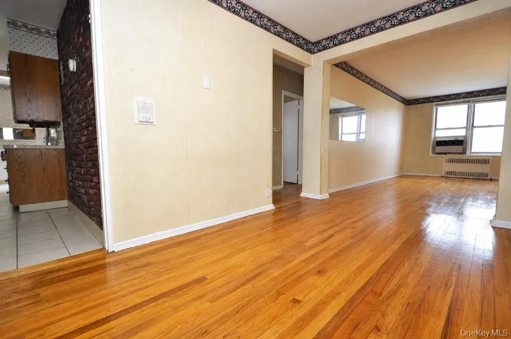 The dining area opens to the living room and has hardwood floors. The dining area is approx. 13'-0" x 8'-3". The dining area opens to the living room and has hardwood floors. The dining area is approx. 13'-0" x 8'-3".