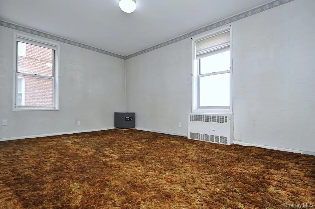 The primary bedroom is a corner room with Hudson River views and covered hardwood floors. The bedroom is approx. 15'-8" x 14' -3". The primary bedroom is a corner room with Hudson River views and covered hardwood floors. The bedroom is approx. 15'-8" x 14' -3".