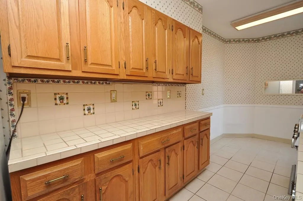 Eat-in kitchen has plenty of cabinets and counter space as well as a dishwasher, range and refrigerator. The kitchen is approx. 21'-7" x 7'-1" Eat-in kitchen has plenty of cabinets and counter space as well as a dishwasher, range and refrigerator. The kitchen is approx. 21'-7" x 7'-1"