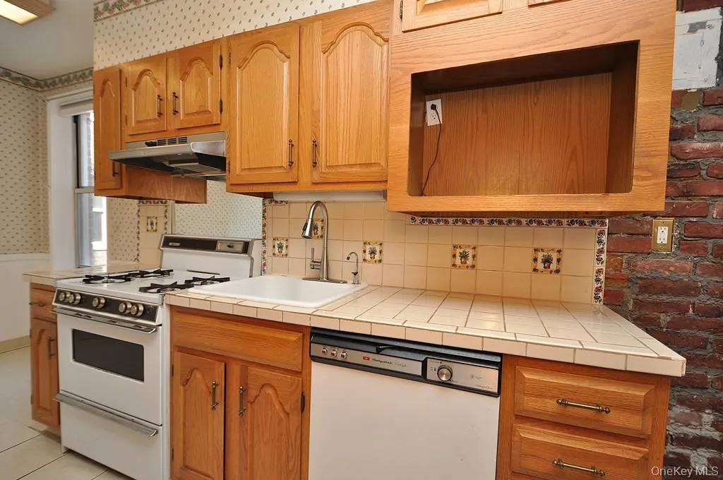 Eat-in kitchen has plenty of cabinets and counter space as well as a dishwasher, range and refrigerator. The kitchen is approx. 21'-7" x 7'-1" Eat-in kitchen has plenty of cabinets and counter space as well as a dishwasher, range and refrigerator. The kitchen is approx. 21'-7" x 7'-1"