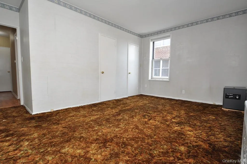 The primary bedroom is a corner room with Hudson River views and covered hardwood floors. The bedroom is approx. 15'-8" x 14' -3". The primary bedroom is a corner room with Hudson River views and covered hardwood floors. The bedroom is approx. 15'-8" x 14' -3".