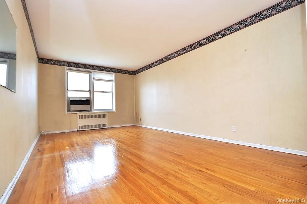 Sunny Living Room has hardwood floors, opens to the dining area and has Hudson River views. The living room is approx. 18'-11" x 11'-3". Sunny Living Room has hardwood floors, opens to the dining area and has Hudson River views. The living room is approx. 18'-11" x 11'-3".