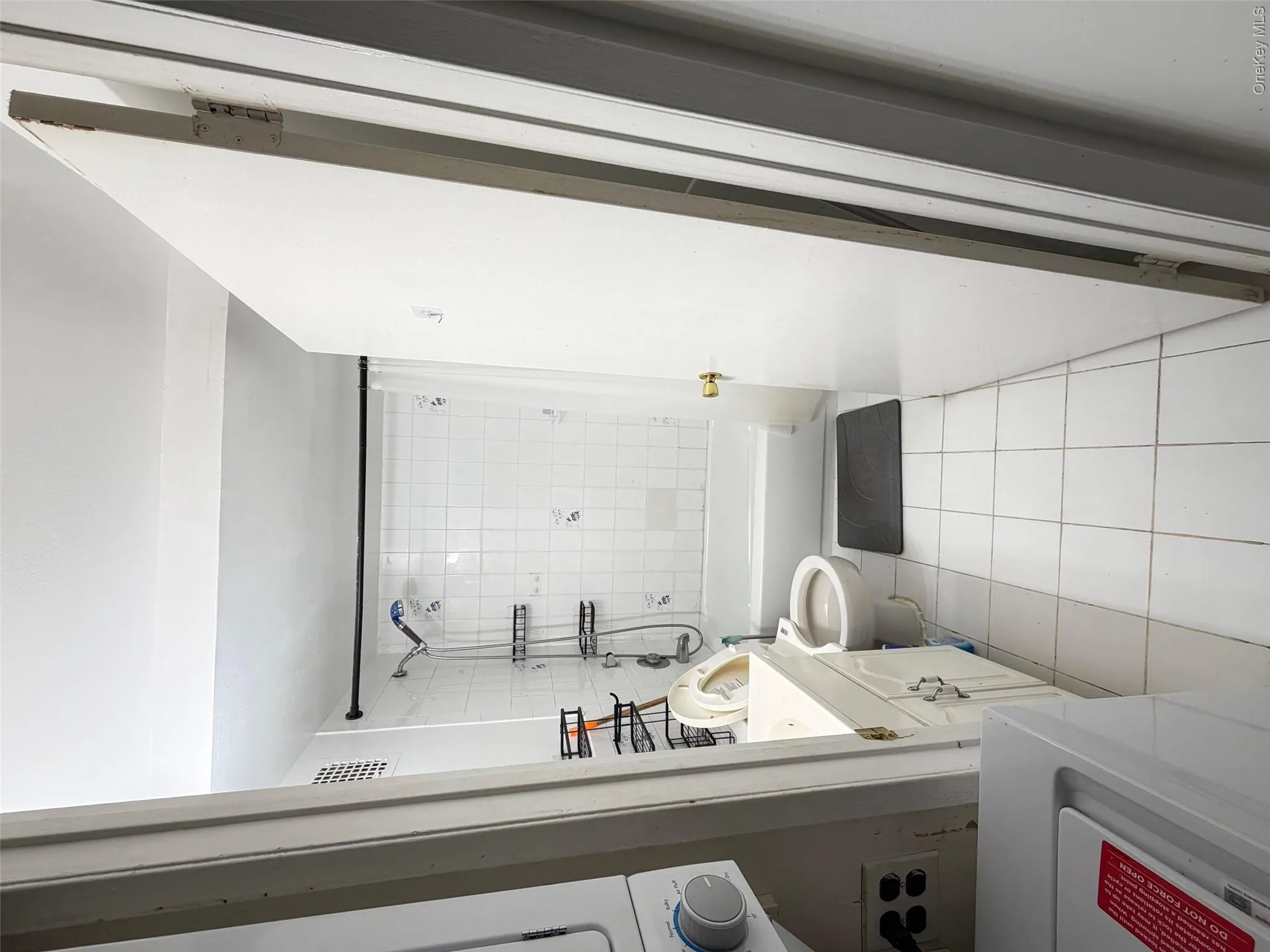 Bathroom with vanity, shower / bath combination with curtain, and light tile patterned floors Bathroom with vanity, shower / bath combination with curtain, and light tile patterned floors