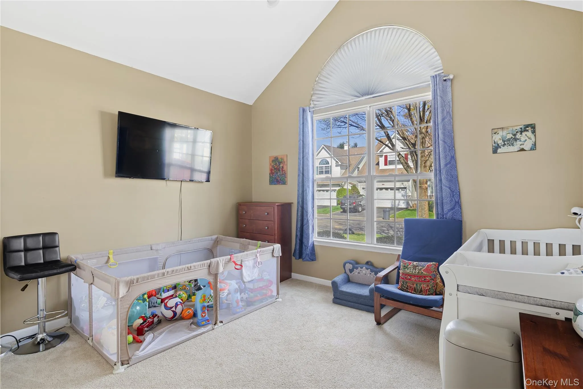First Floor ,vaulted ceiling, arched window with blind, carpeted flooring, and neutral wall tones First Floor ,vaulted ceiling, arched window with blind, carpeted flooring, and neutral wall tones