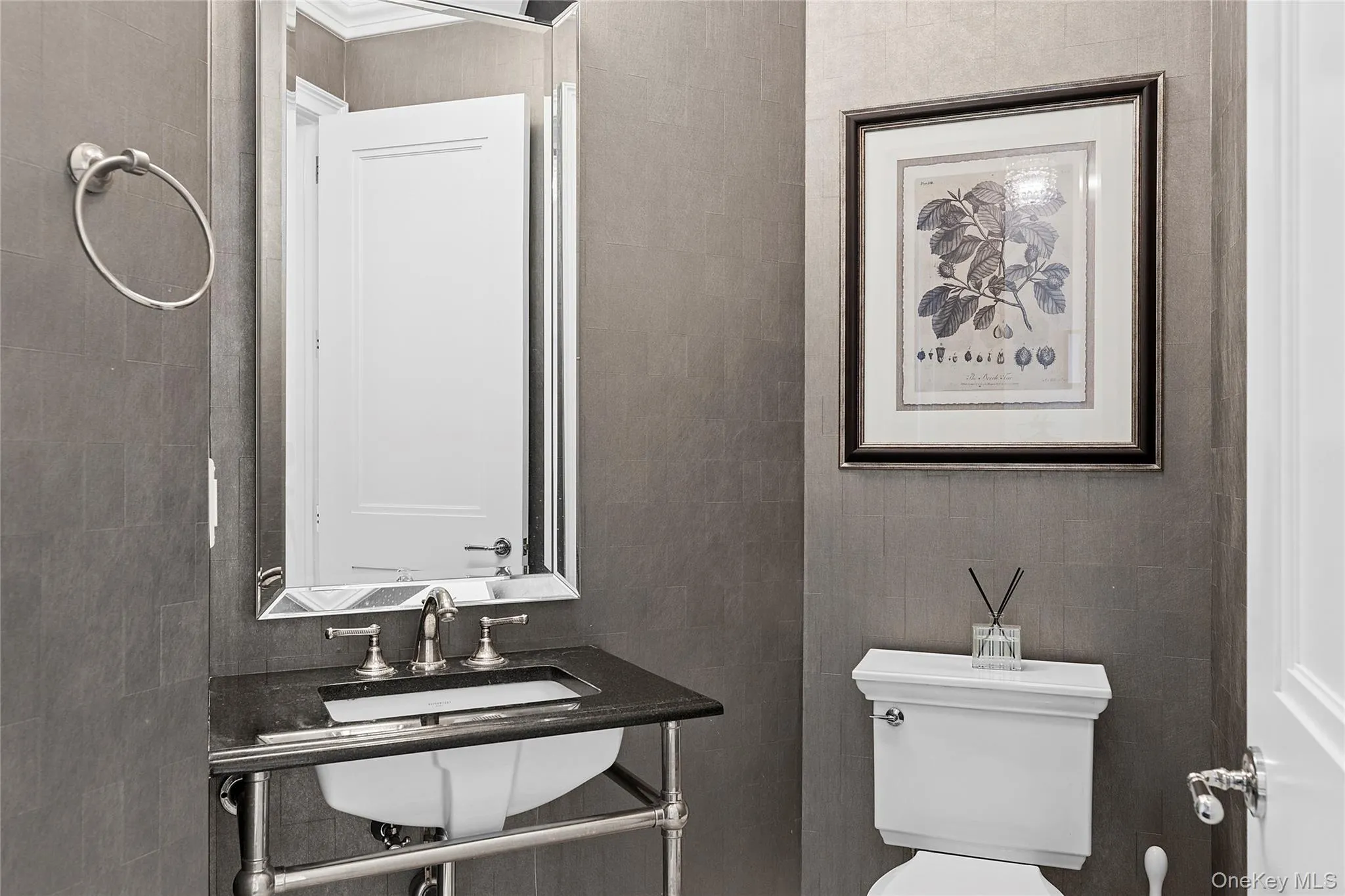Half bath with toilet and tile walls Half bath with toilet and tile walls