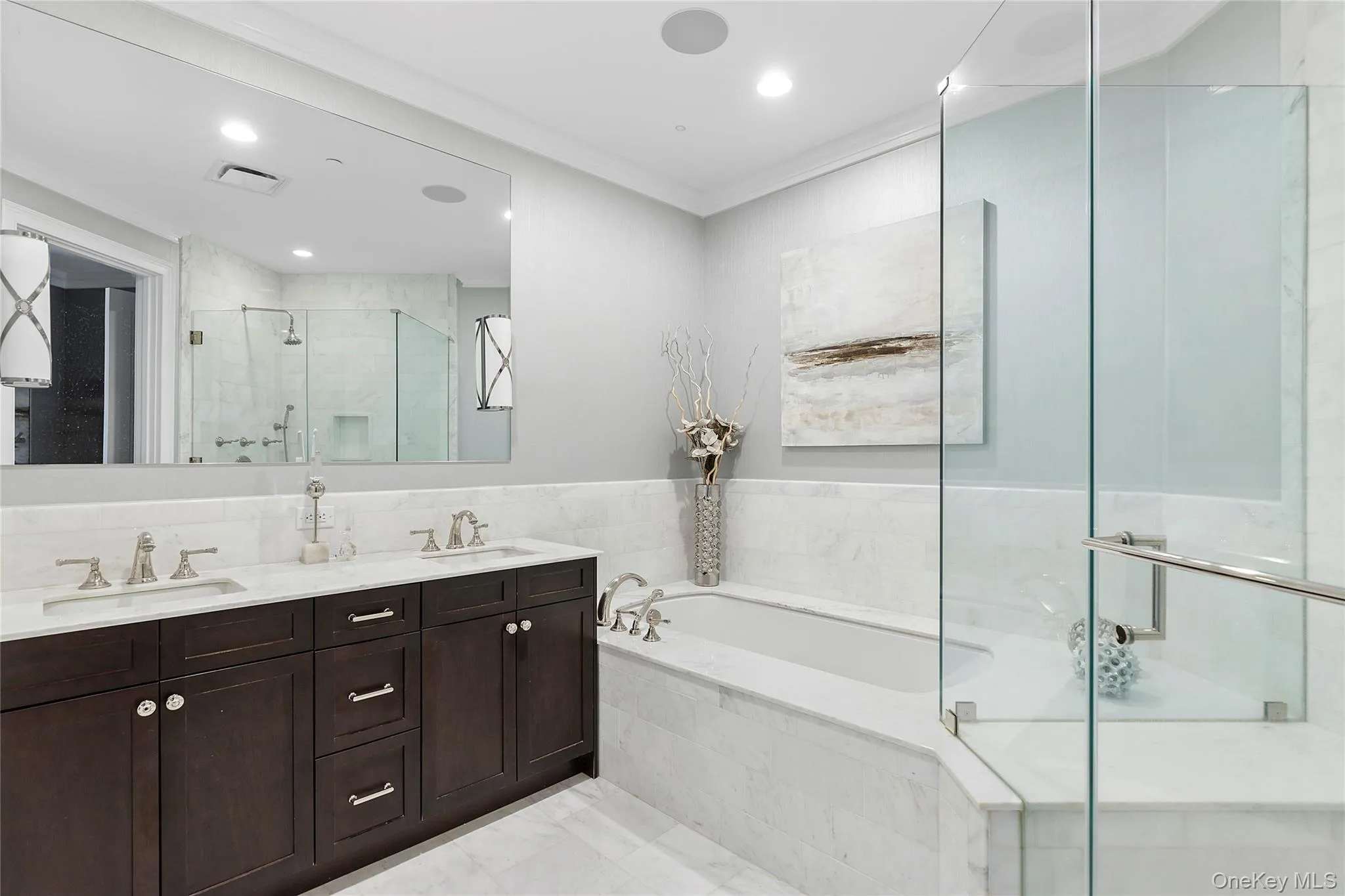 Full bathroom with ornamental molding, a sink, a bath, and a stall shower Full bathroom with ornamental molding, a sink, a bath, and a stall shower