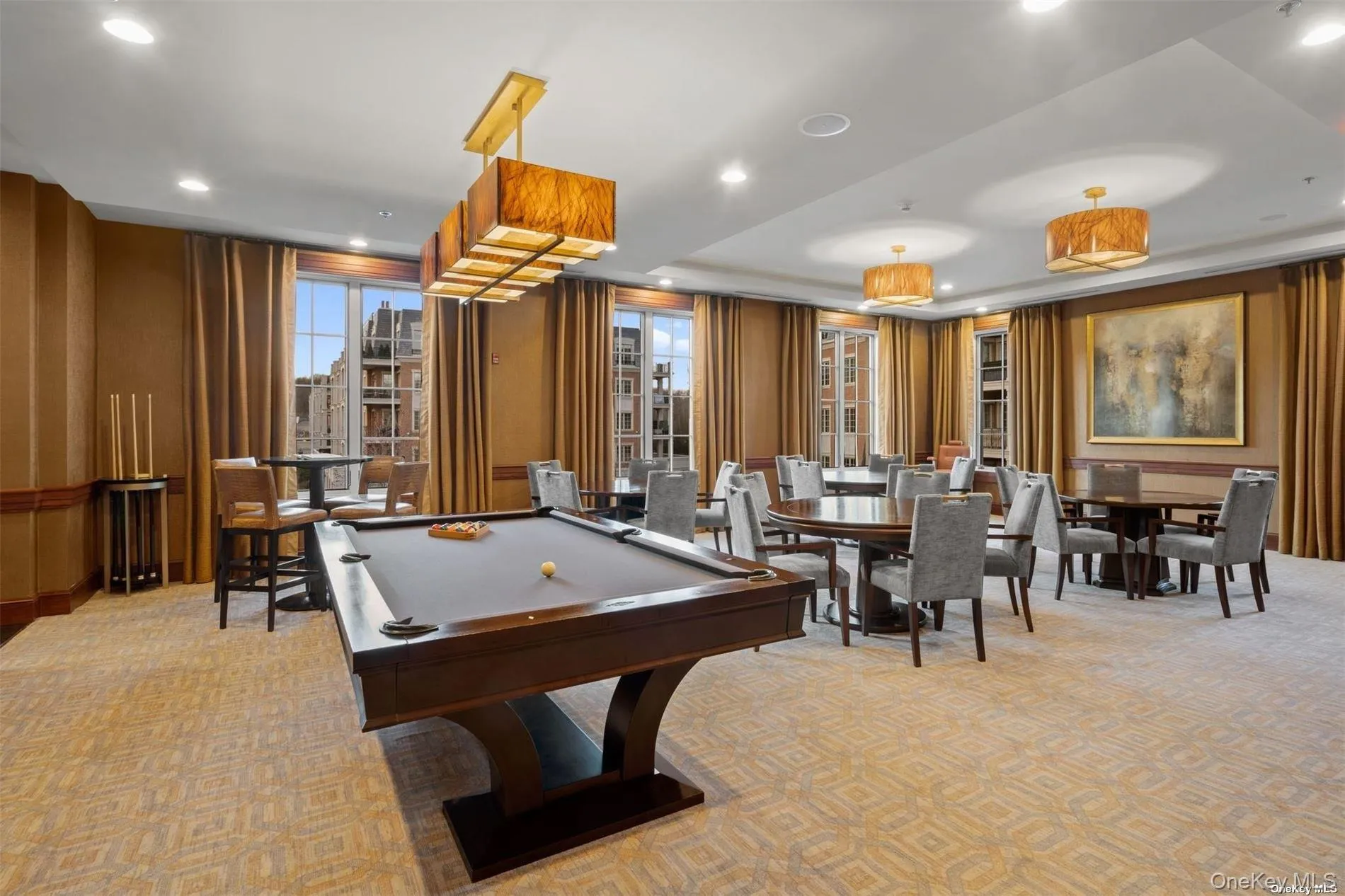 Rec room featuring recessed lighting, billiards, a healthy amount of sunlight, and light carpet Rec room featuring recessed lighting, billiards, a healthy amount of sunlight, and light carpet