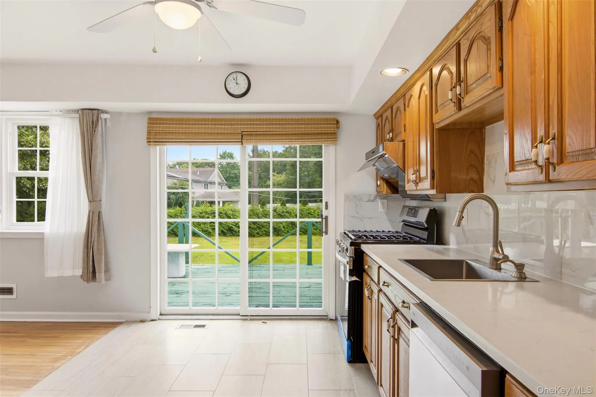 Eat-In Kitchen with Sliders to Rear Deck Eat-In Kitchen with Sliders to Rear Deck