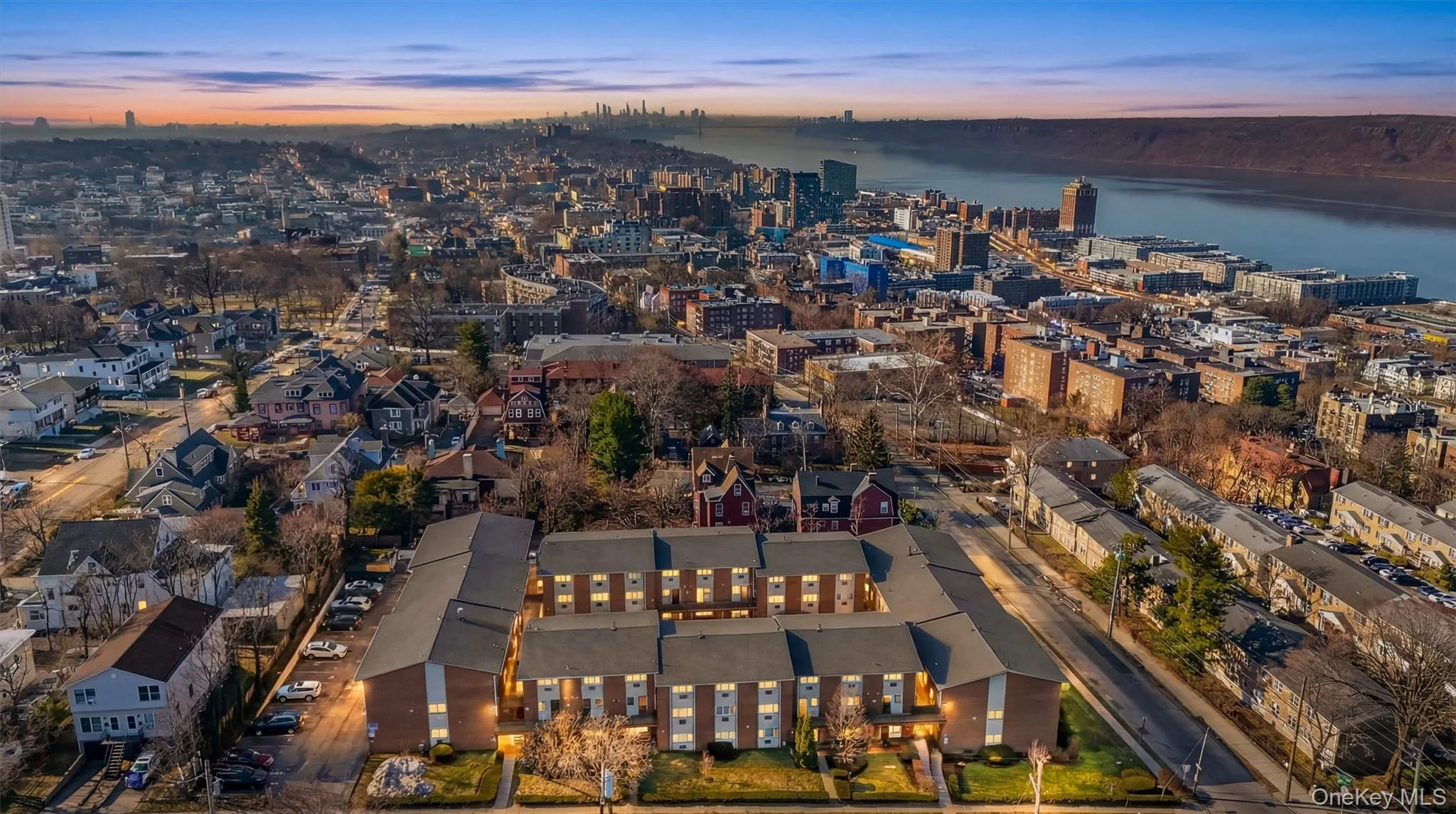 Stunning twilight aerial showcasing the property with sweeping Hudson River and Manhattan skyline views Stunning twilight aerial showcasing the property with sweeping Hudson River and Manhattan skyline views