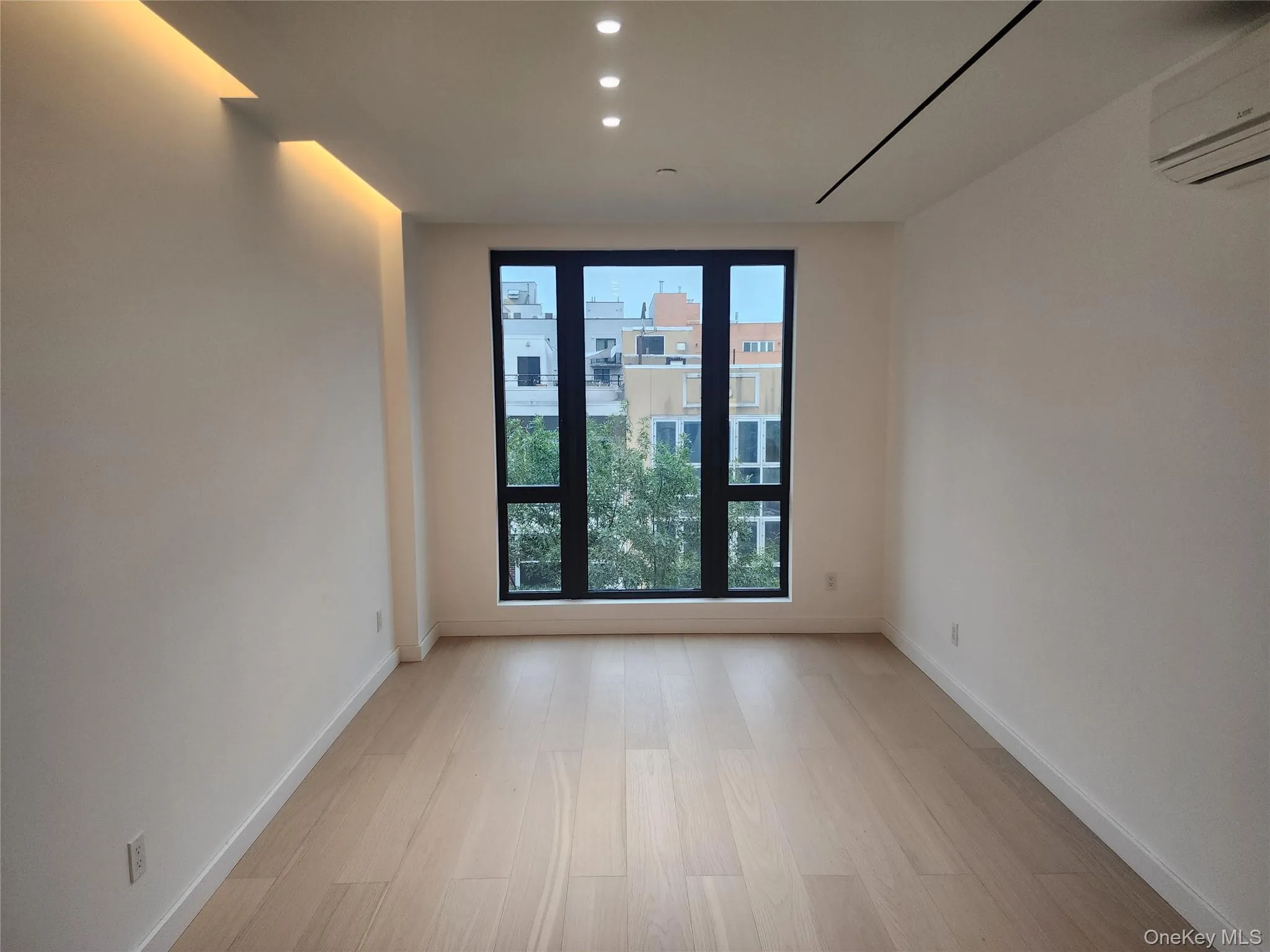 Light wood-finish flooring with white walls Light wood-finish flooring with white walls