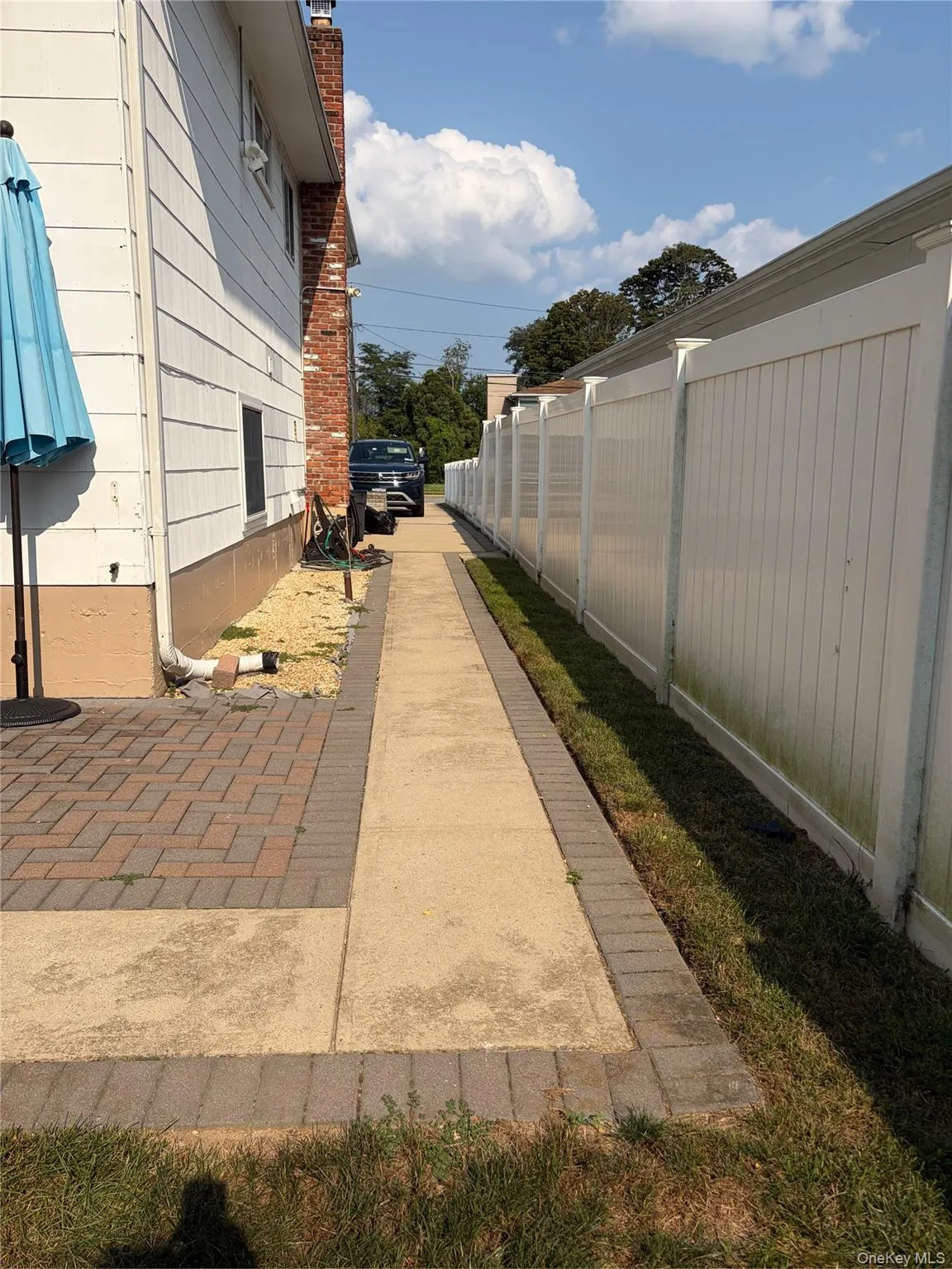 Side view walk path to backyard. Side view walk path to backyard.