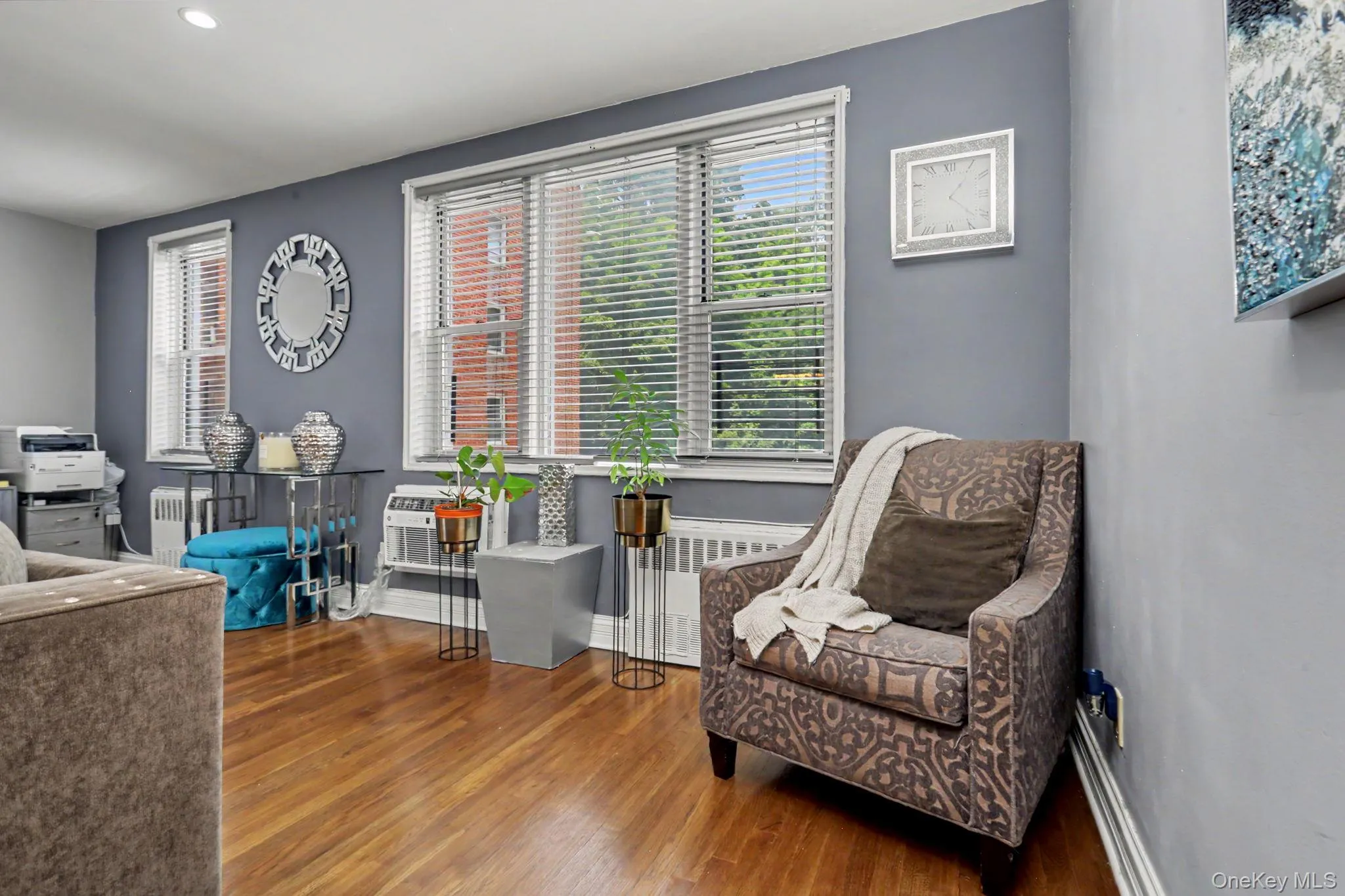 Hardwood flooring, recessed ceiling lighting, and multiple windows Hardwood flooring, recessed ceiling lighting, and multiple windows