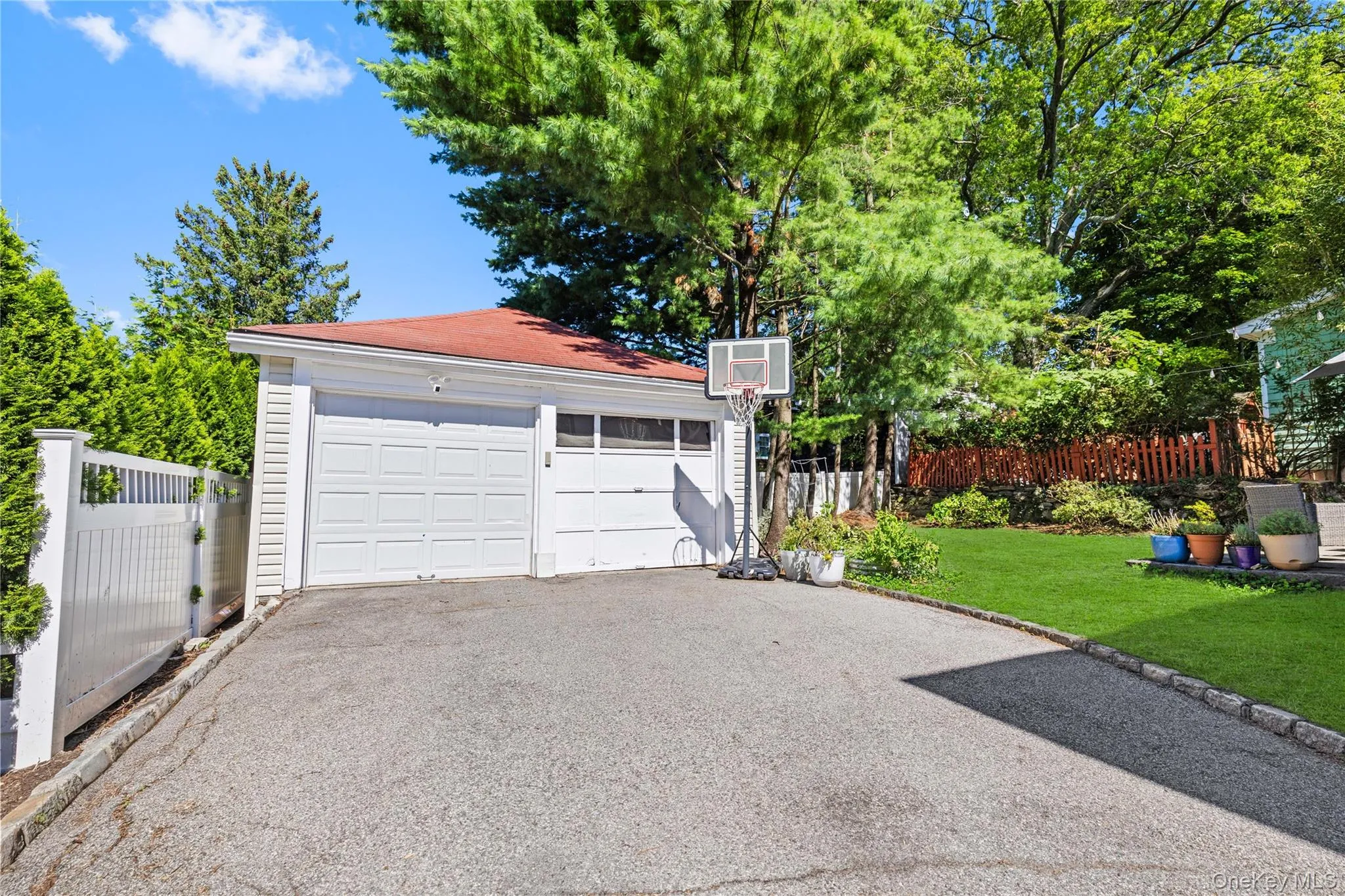 Long driveway to detached 2-car garage. Long driveway to detached 2-car garage.