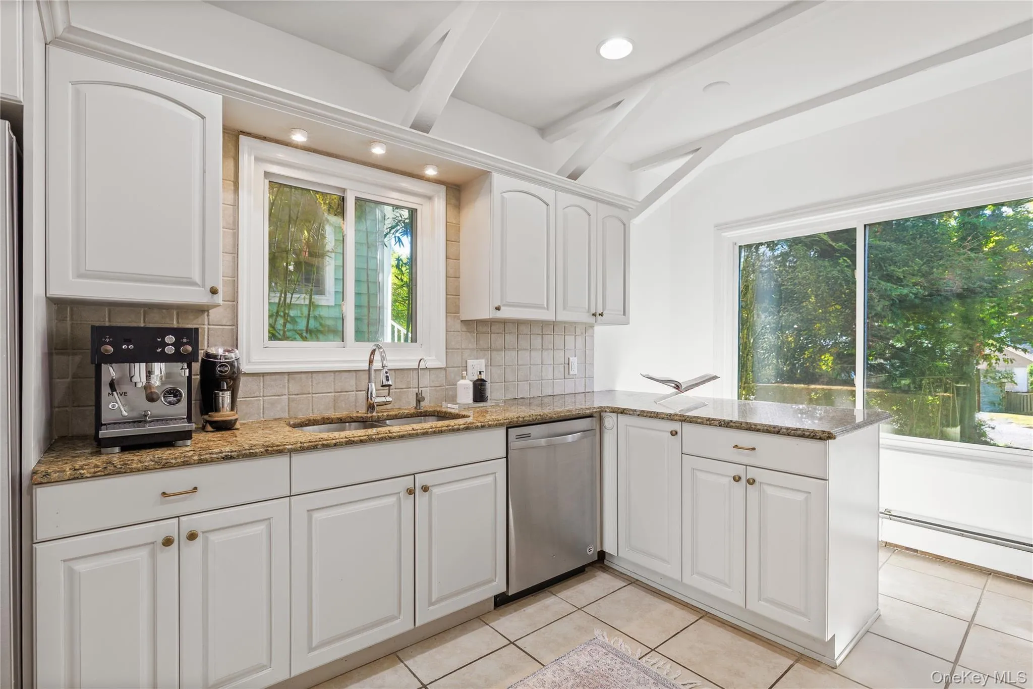 Kitchen offering ample cabinet storage Kitchen offering ample cabinet storage
