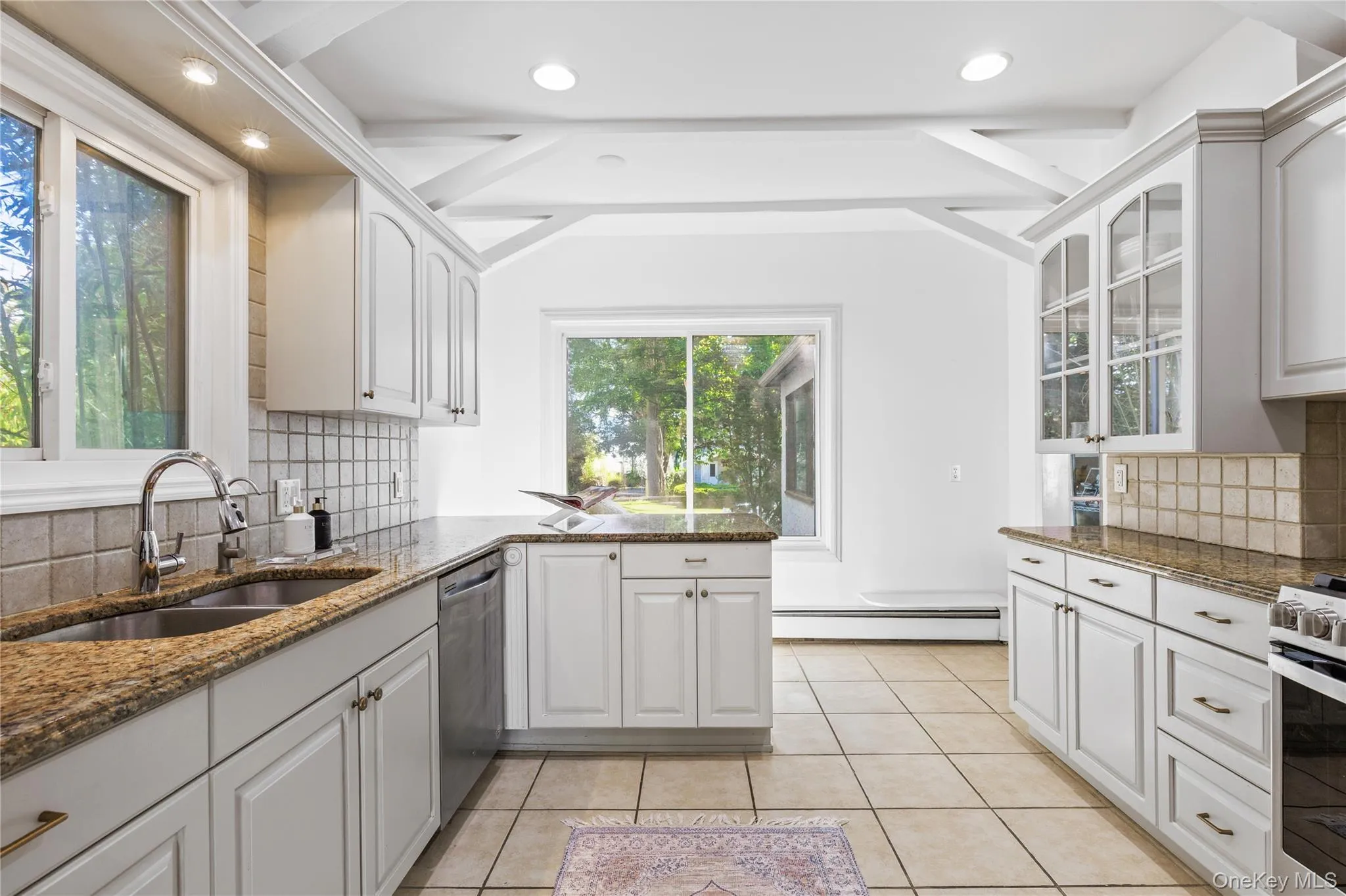Beamed ceilings in the kitchen with room for casual eat-in-dining Beamed ceilings in the kitchen with room for casual eat-in-dining