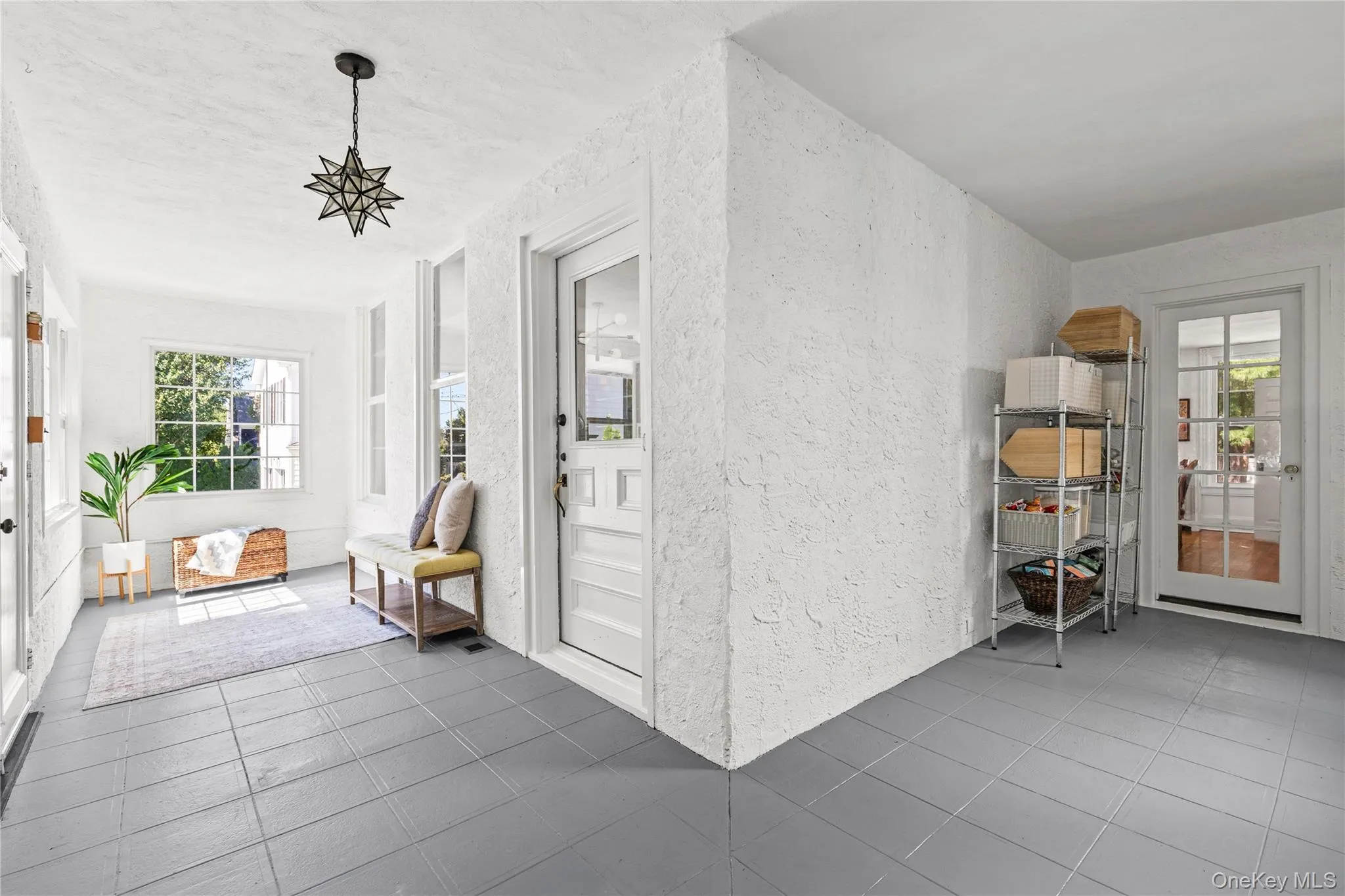 The enclosed porch offers two convenient access points inside the home The enclosed porch offers two convenient access points inside the home