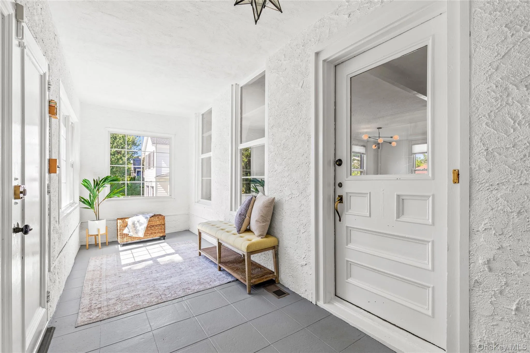 Enclosed, wrap-around porch with new windows Enclosed, wrap-around porch with new windows