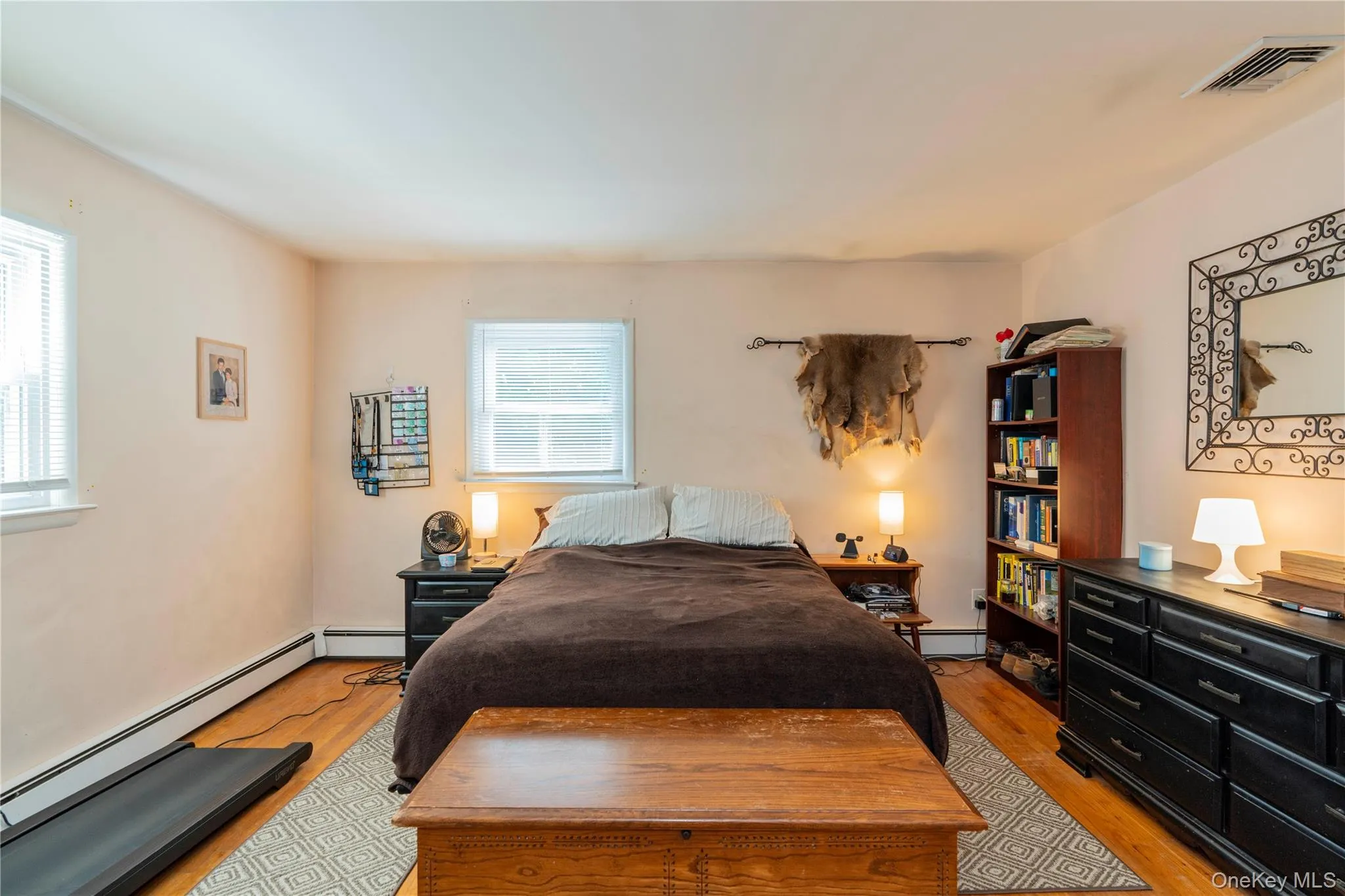 Big Primary Bedroom with Hardwood Floors Big Primary Bedroom with Hardwood Floors