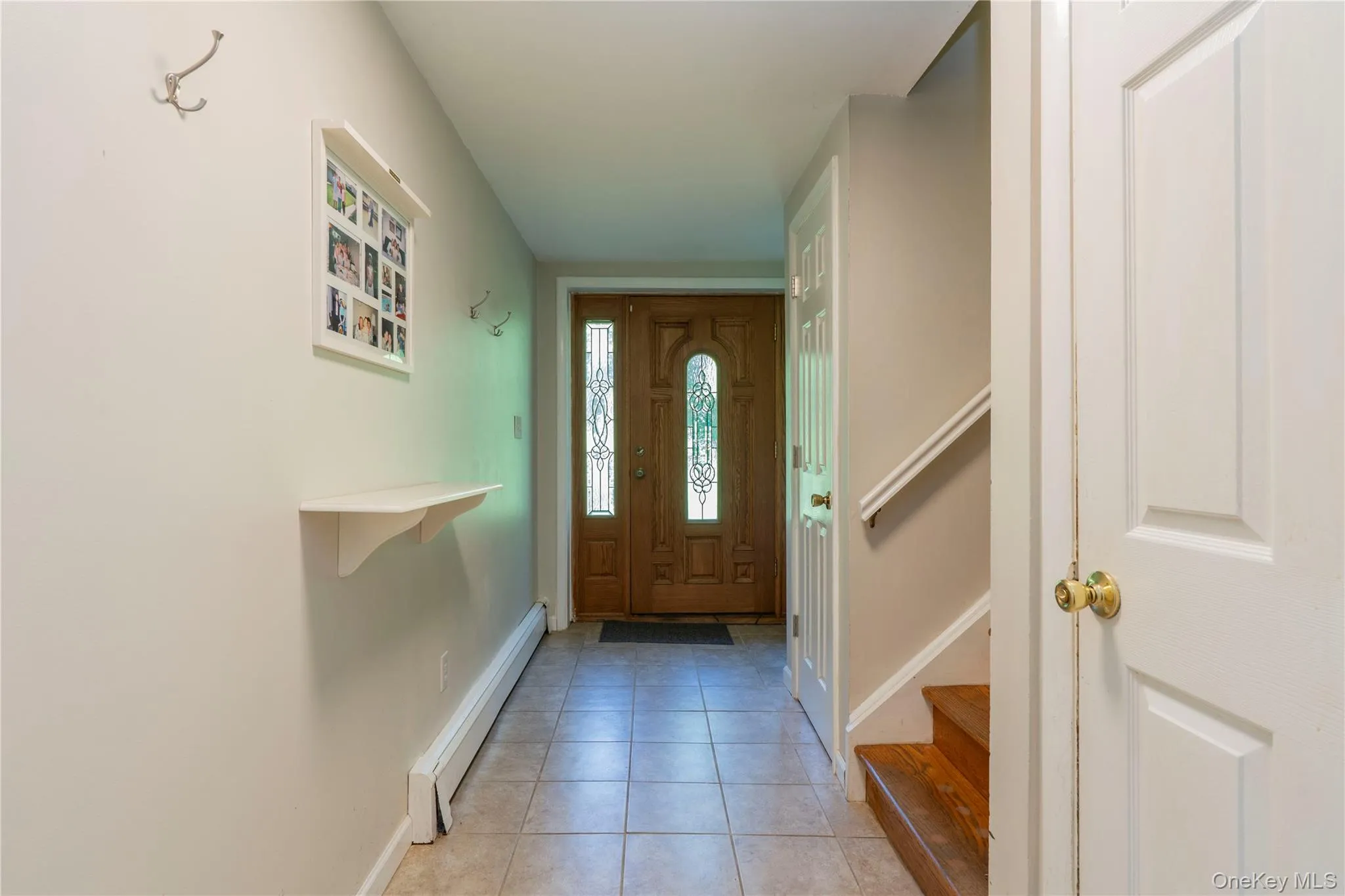 Entry Hall - straight ahead to the oversized Family Room, an office and the laundry w a door to the Garage Entry Hall - straight ahead to the oversized Family Room, an office and the laundry w a door to the Garage