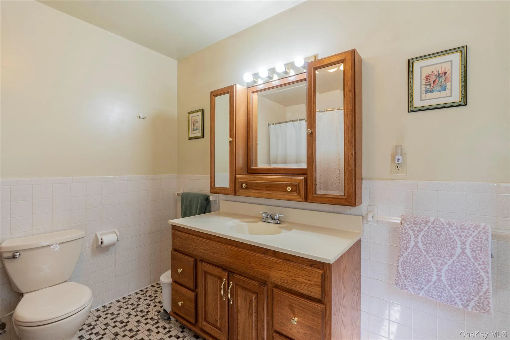 Spacious Bath with wooden vanity Spacious Bath with wooden vanity