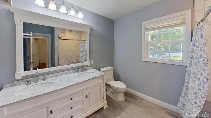 a BIG primary bedroom bathroom with lots of light and a window too! a BIG primary bedroom bathroom with lots of light and a window too!