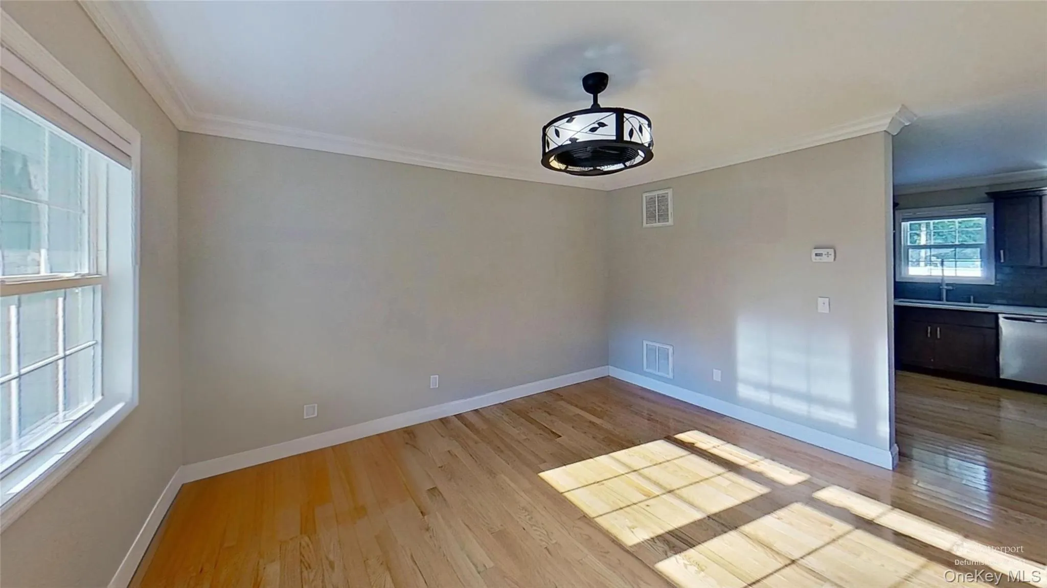 This family room features crown moldings, great views and an integral part of this open floorplan great layout! This family room features crown moldings, great views and an integral part of this open floorplan great layout!
