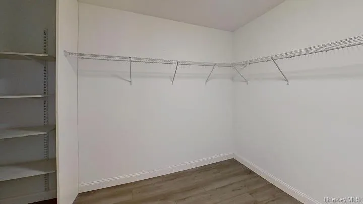 CUSTOM closet organizer system is included in this BIG primary bedroom walk-in closet. CUSTOM closet organizer system is included in this BIG primary bedroom walk-in closet.