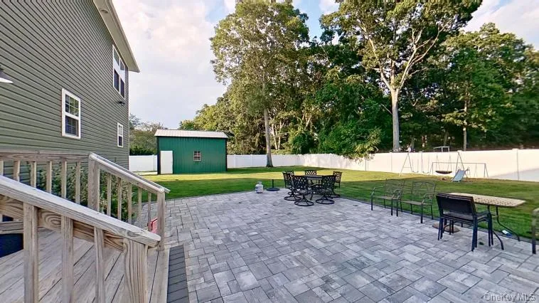 Custom patio is great for entertaining and the detached 3rd garage with high ceiling and car lift, make this a dream setting in the fenced backyard! Custom patio is great for entertaining and the detached 3rd garage with high ceiling and car lift, make this a dream setting in the fenced backyard!