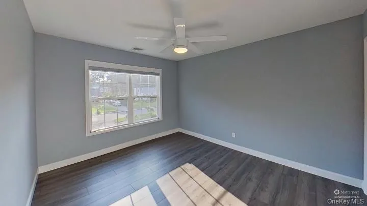 Big windows and a ceiling fan are part of this CLEAN bedroom space. Big windows and a ceiling fan are part of this CLEAN bedroom space.
